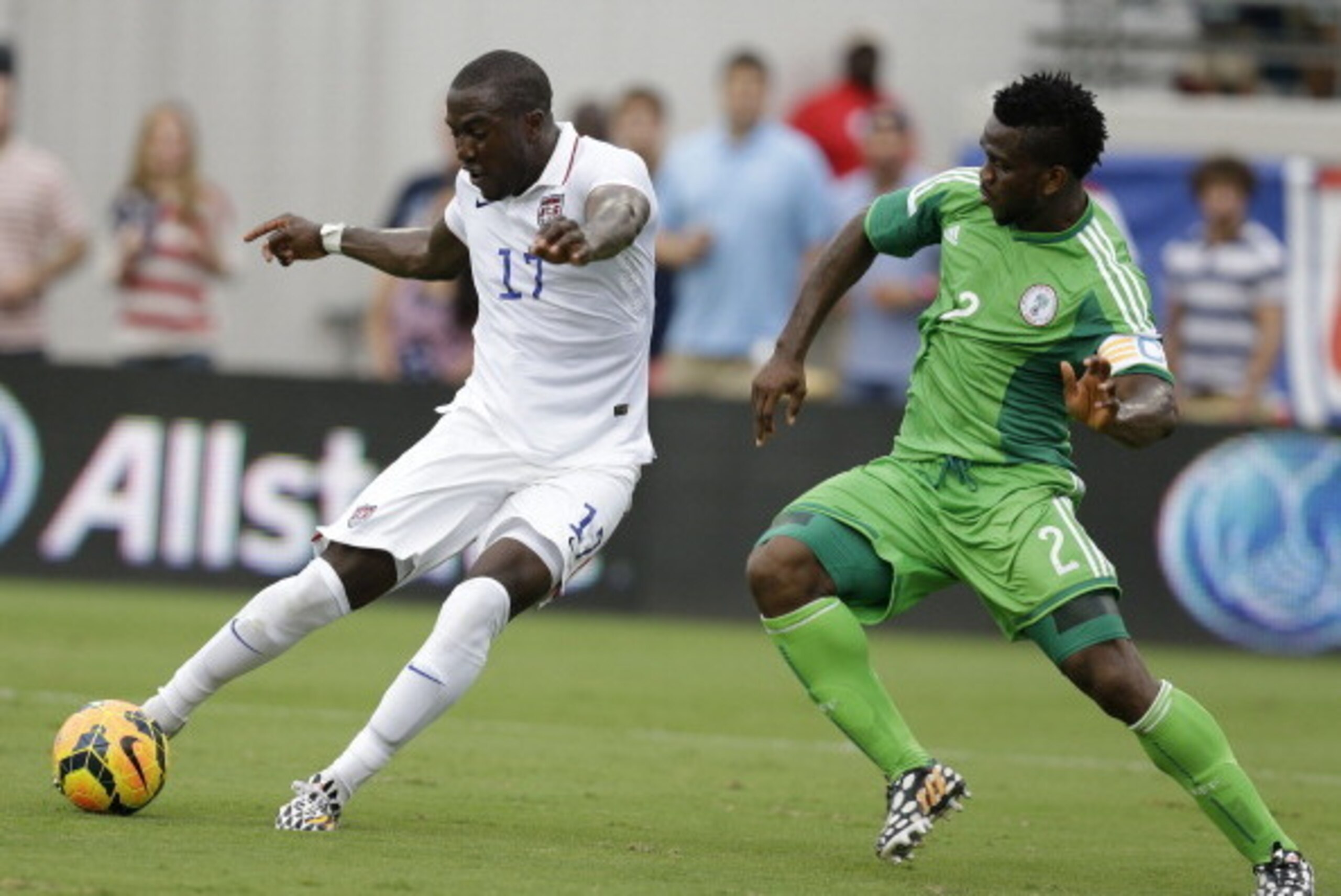 JACKSONVILLE, FL - JUNE 07:  Forward Jozy Altidore #17 of the United States shoots and scores his second game of the game behind defender Joseph Yobo #2 of Nigeria during the international friendly match at EverBank Field on June 7, 2014 in Jacksonville, 