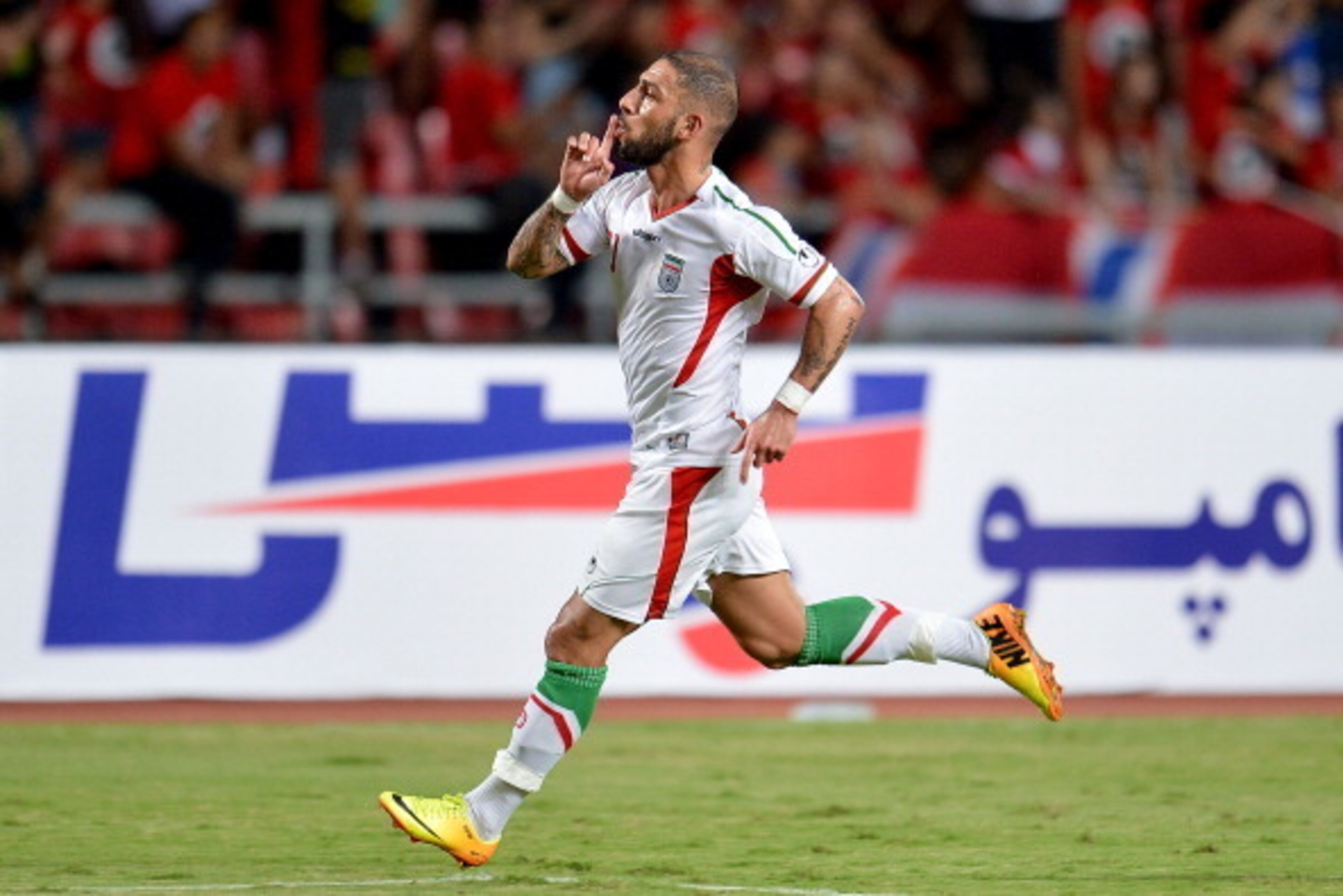 BANGKOK, THAILAND - NOVEMBER 15:  Ashkan Dejagah of Iran celebrates his goal during their 2015 Asian Cup group B qualifying football match at Rajamangala Stadium on November 15, 2013 in Bangkok, Thailand.  (Photo by Thananuwat Srirasant/Getty Images)