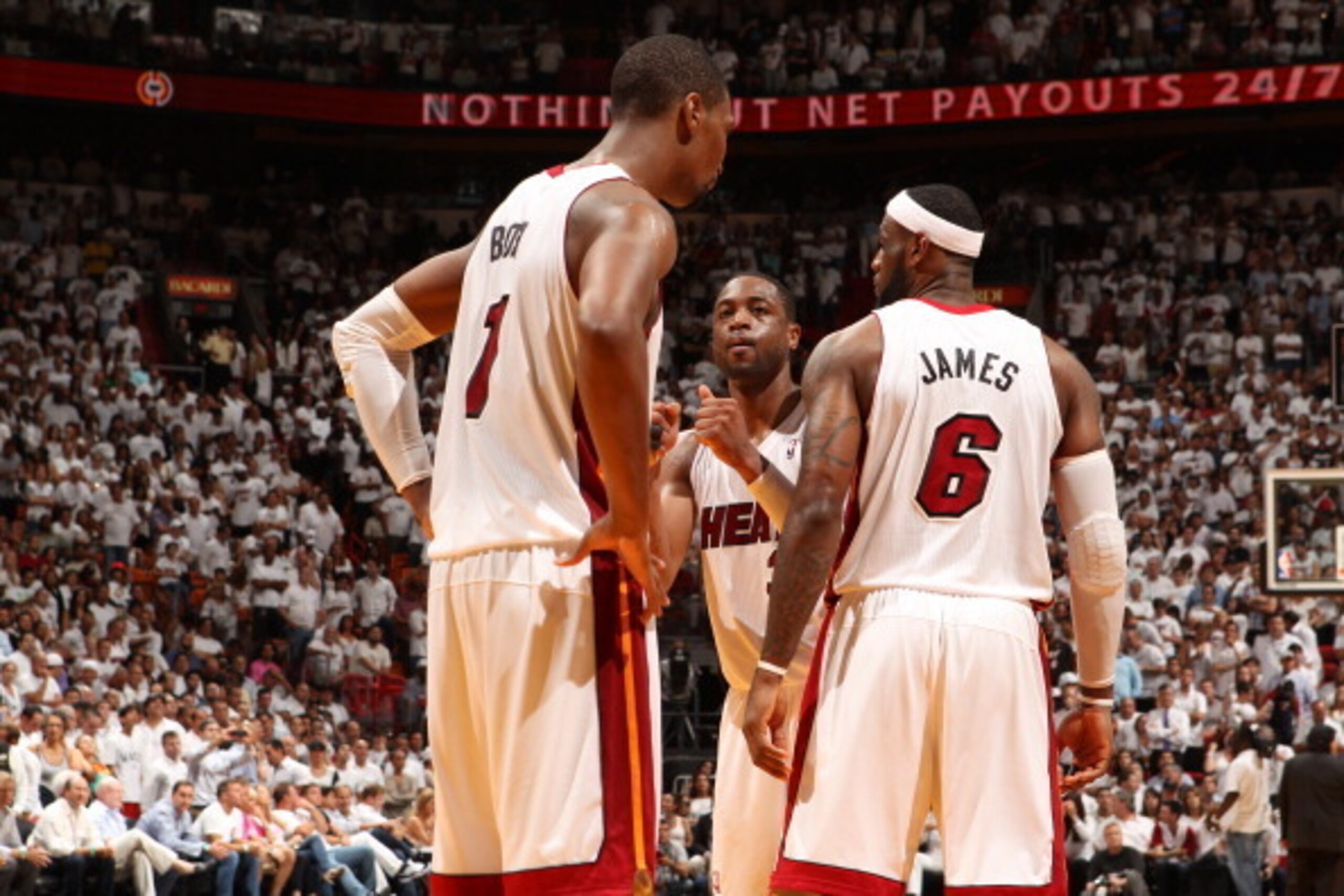 MIAMI, FL - MAY 14: Dwyane Wade #3, LeBron James #6, and Chris Bosh #1 of the Miami Heat talk in Game Five of the Eastern Conference Semifinals against the Brooklyn Nets during the 2014 NBA playoffs at American Airlines Arena in Miami, Florida on May 14, 