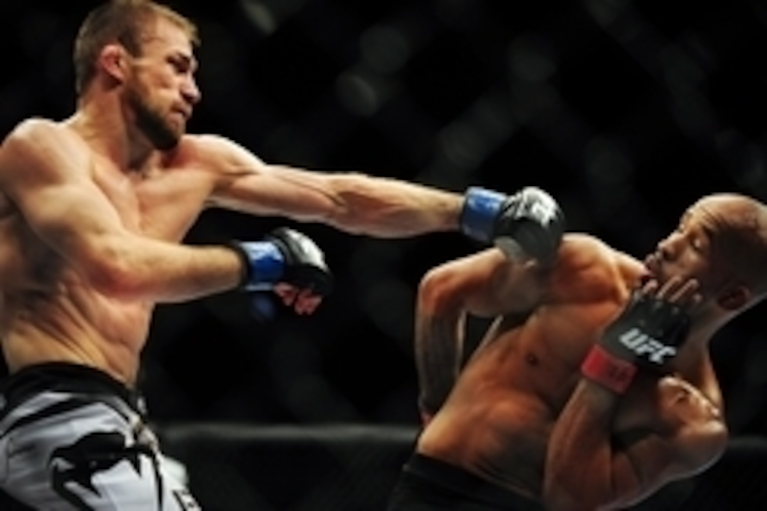 Jun 14, 2014; Vancouver, British Columbia, Canada; Demetrious Johnson (red) fights against Ali Bagautinov (blue) in the flyweight title bout at UFC 174 at Rogers Arena. Mandatory Credit: Anne-Marie Sorvin-USA TODAY Sports