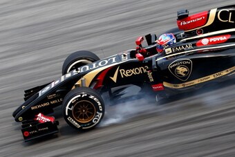 KUALA LUMPUR, MALAYSIA - MARCH 28:  Romain Grosjean of France and Lotus locks up during practice for the Malaysia Formula One Grand Prix at the Sepang Circuit on March 28, 2014 in Kuala Lumpur, Malaysia.  (Photo by Paul Gilham/Getty Images)