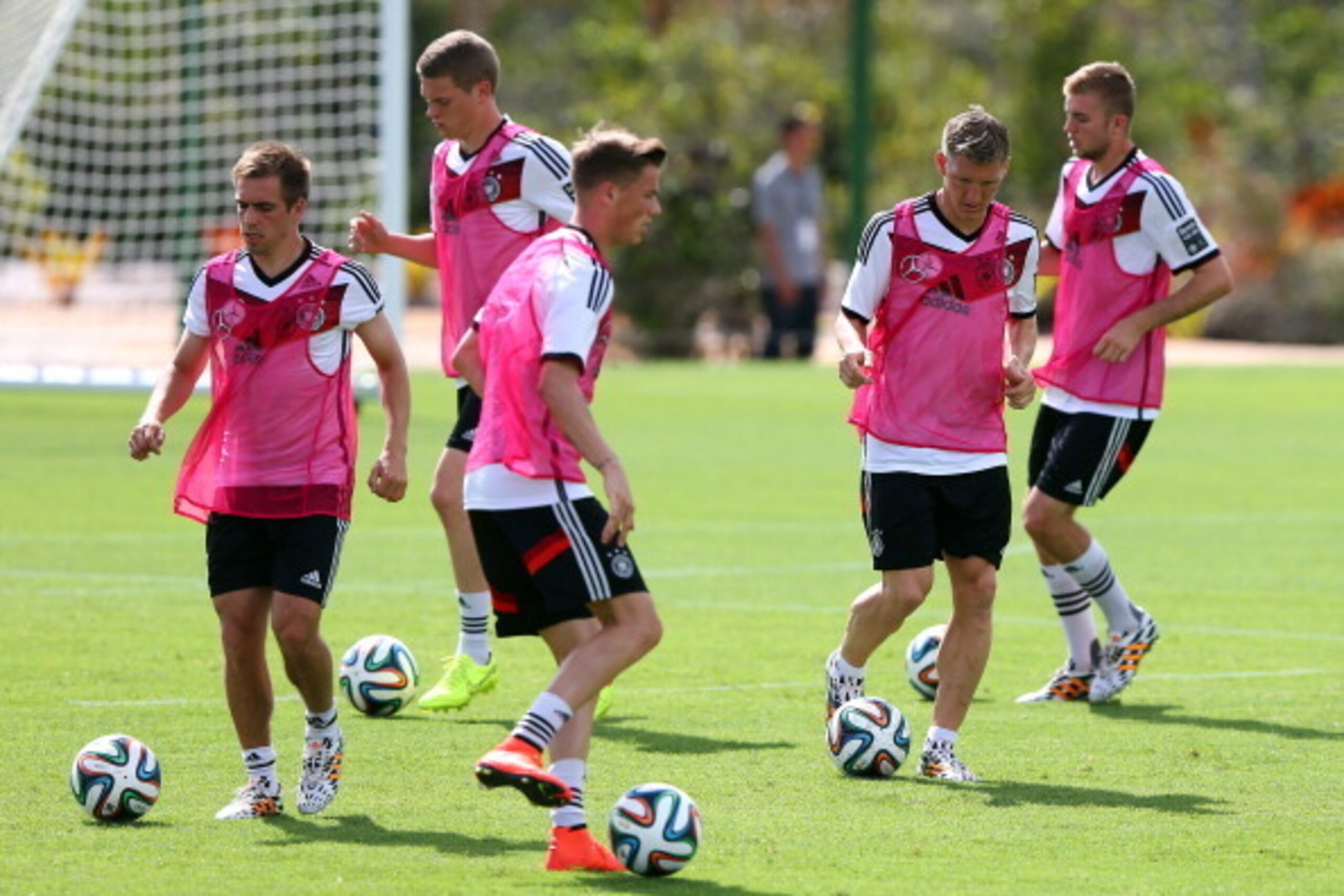 SANTO ANDRE, BRAZIL - JUNE 12: Bastian Schweinsteiger (2nd R) controls the ball during the German National team training session at Campo Bahia on June 12, 2014 in Santo Andre, Brazil.  (Photo by Martin Rose/Getty Images)