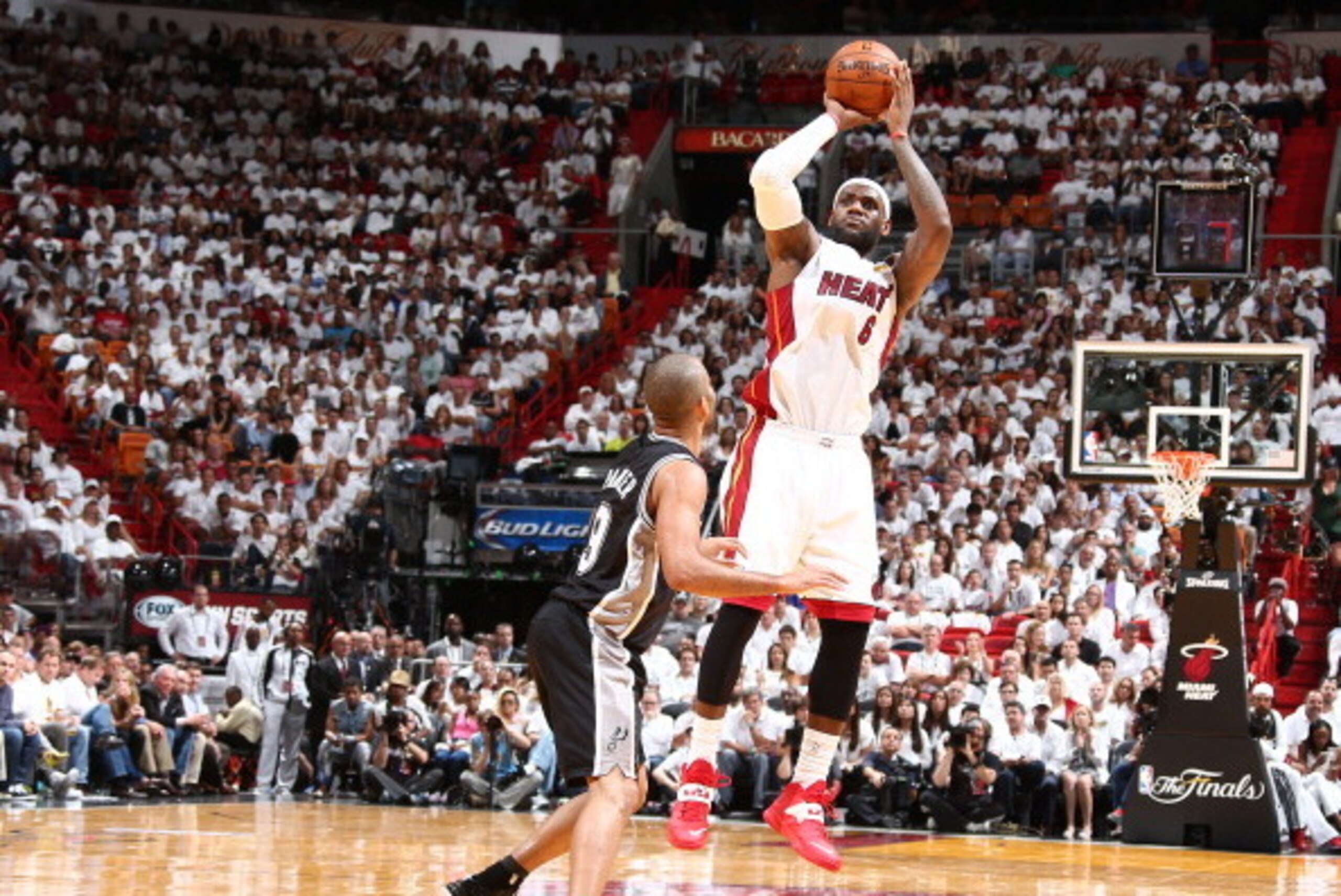 MIAMI, FL - JUNE 12: LeBron James #6 of the Miami Heat shoots over Tony Parker #9 of the San Antonio Spurs during Game Four of the 2014 NBA Finals at American Airlines Arena in Miami, Florida on June 12, 2014.  NOTE TO USER: User expressly acknowledges an
