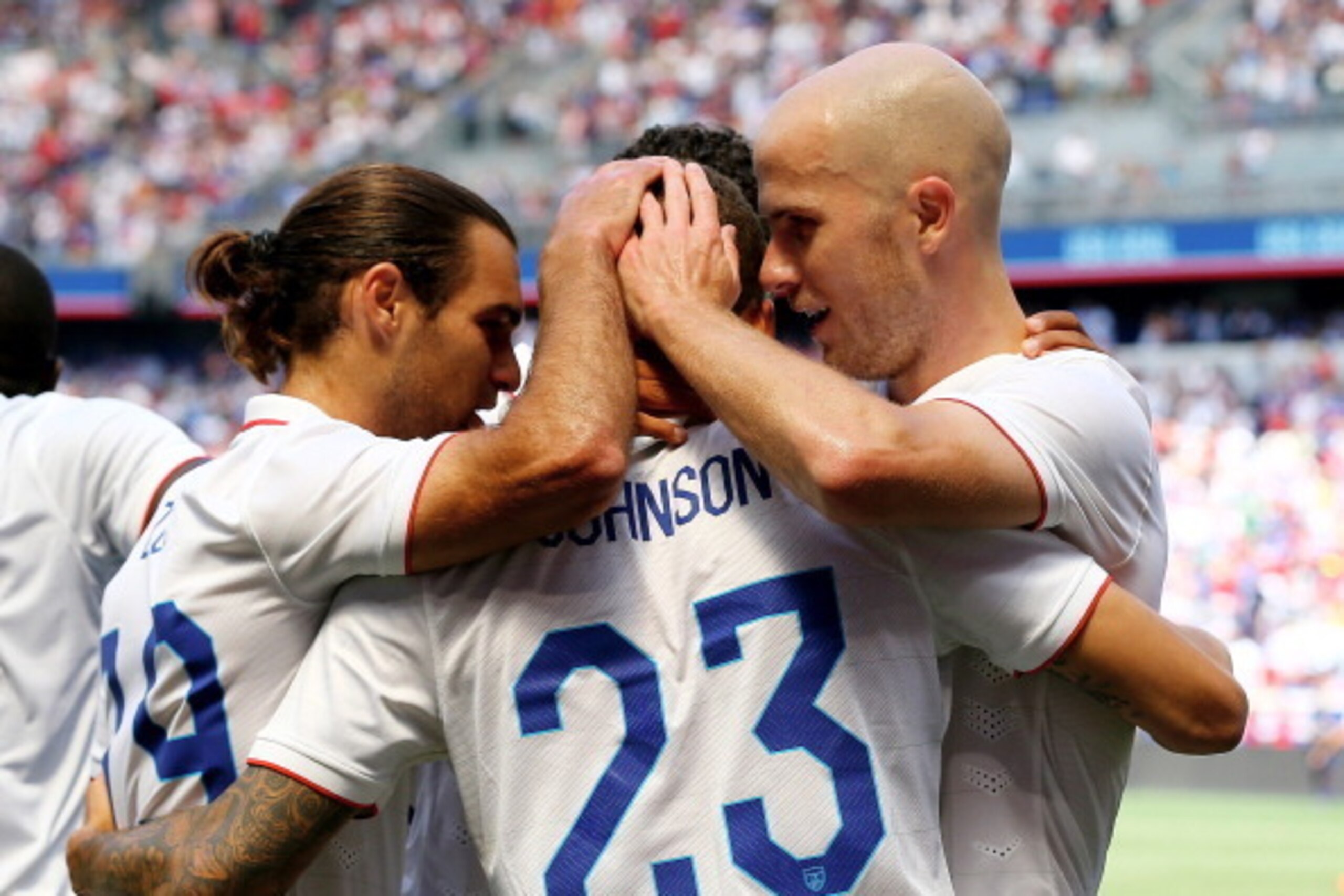 HARRISON, NJ - JUNE 01:  Graham Zusi #19 and Michael Bradley #4 of the United States congratulate teammate Fabian Johnson #23 after Johnson scored in the first half against Turkey during an international friendly match at Red Bull Arena on June 1, 2014 in