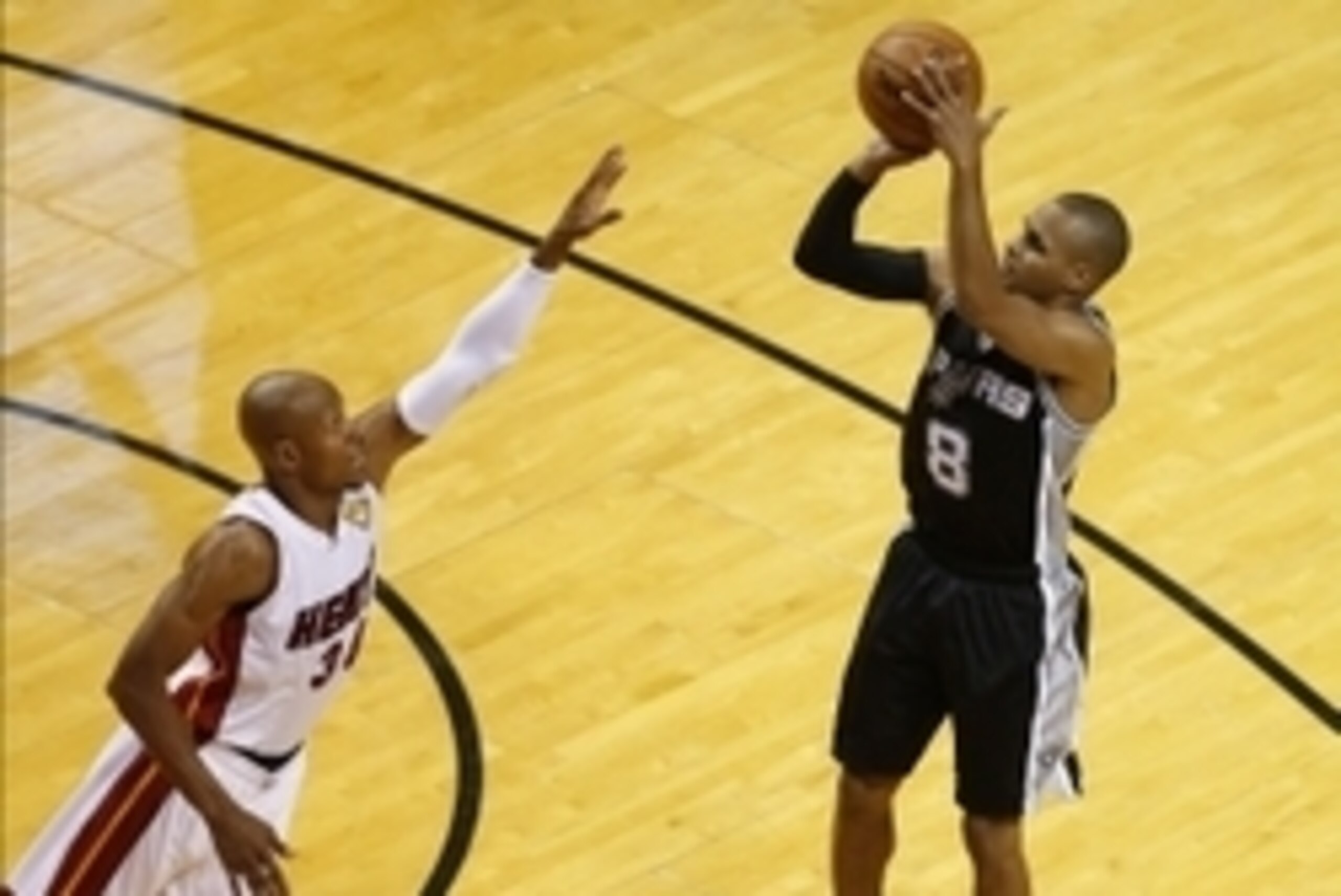 Jun 10, 2014; Miami, FL, USA; San Antonio Spurs guard Patty Mills (8) shoots while defended by Miami Heat guard Ray Allen (34) during the third quarter of game three of the 2014 NBA Finals at American Airlines Arena. Mandatory Credit: Robert Mayer-USA TOD