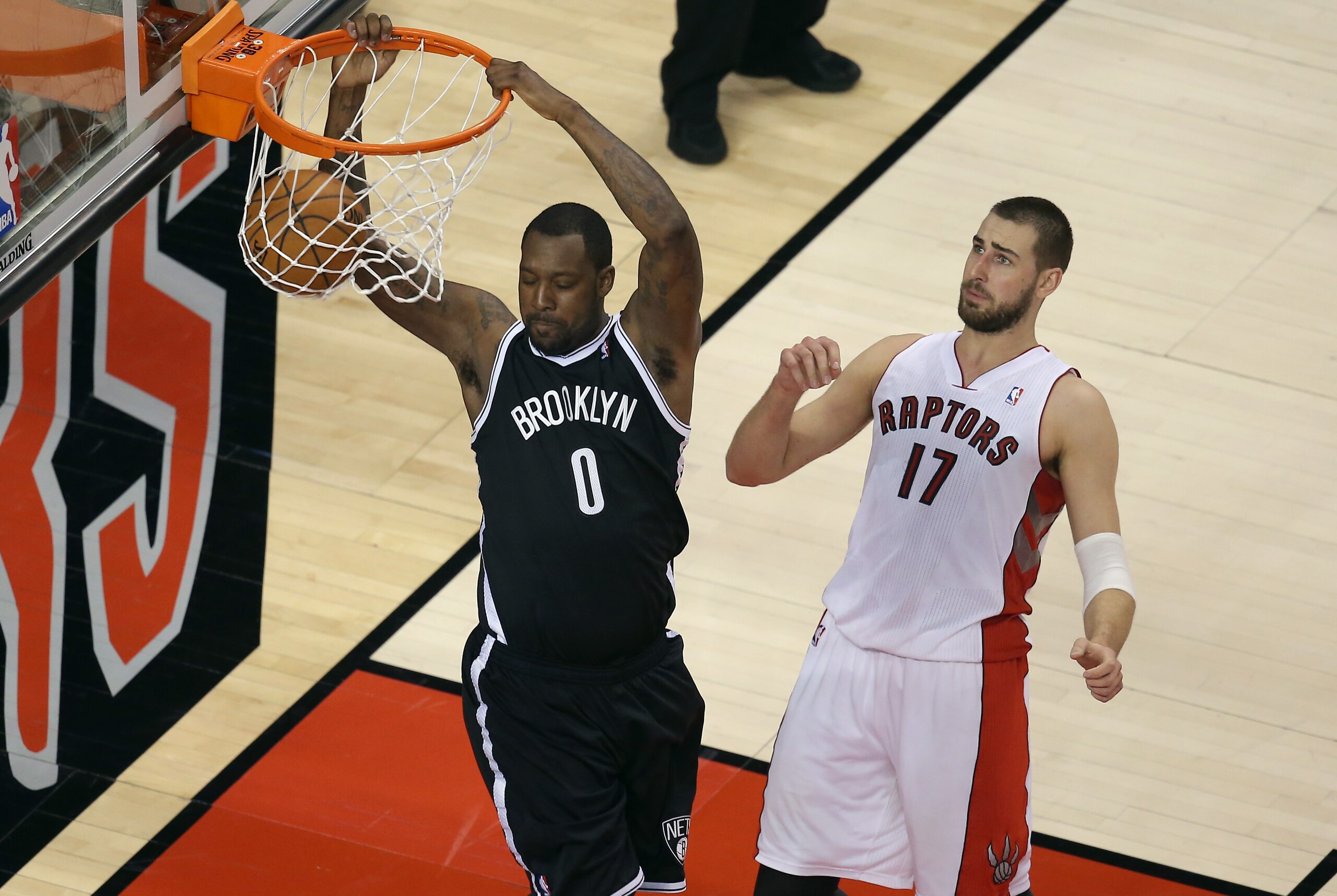 May 4, 2014; Toronto, Ontario, CAN; Brooklyn Nets forward Andray Blatche (0) dunks against Toronto Raptors center Jonas Valanciunas (17) in game seven of the first round of the 2014 NBA Playoffs at Air Canada Centre. Mandatory Credit: Tom Szczerbowski-USA