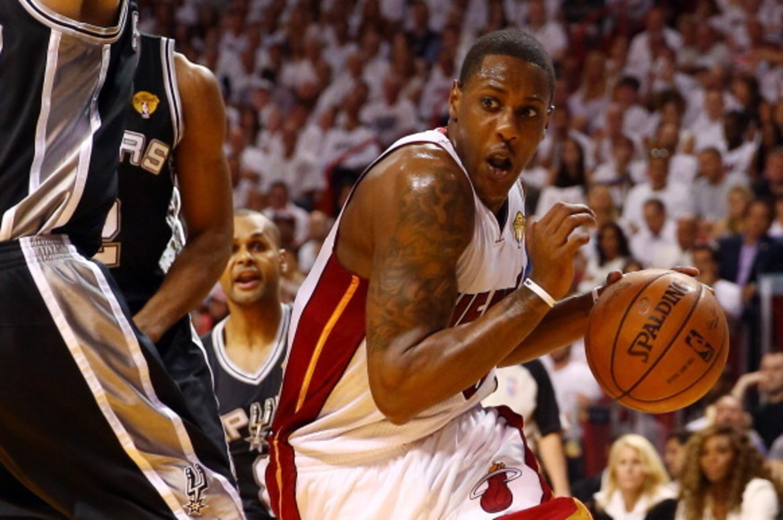 MIAMI, FL - JUNE 12:  Mario Chalmers #15 of the Miami Heat drives to the basket against Tiago Splitter #22 of the San Antonio Spurs during Game Four of the 2014 NBA Finals at American Airlines Arena on June 12, 2014 in Miami, Florida. NOTE TO USER: User e