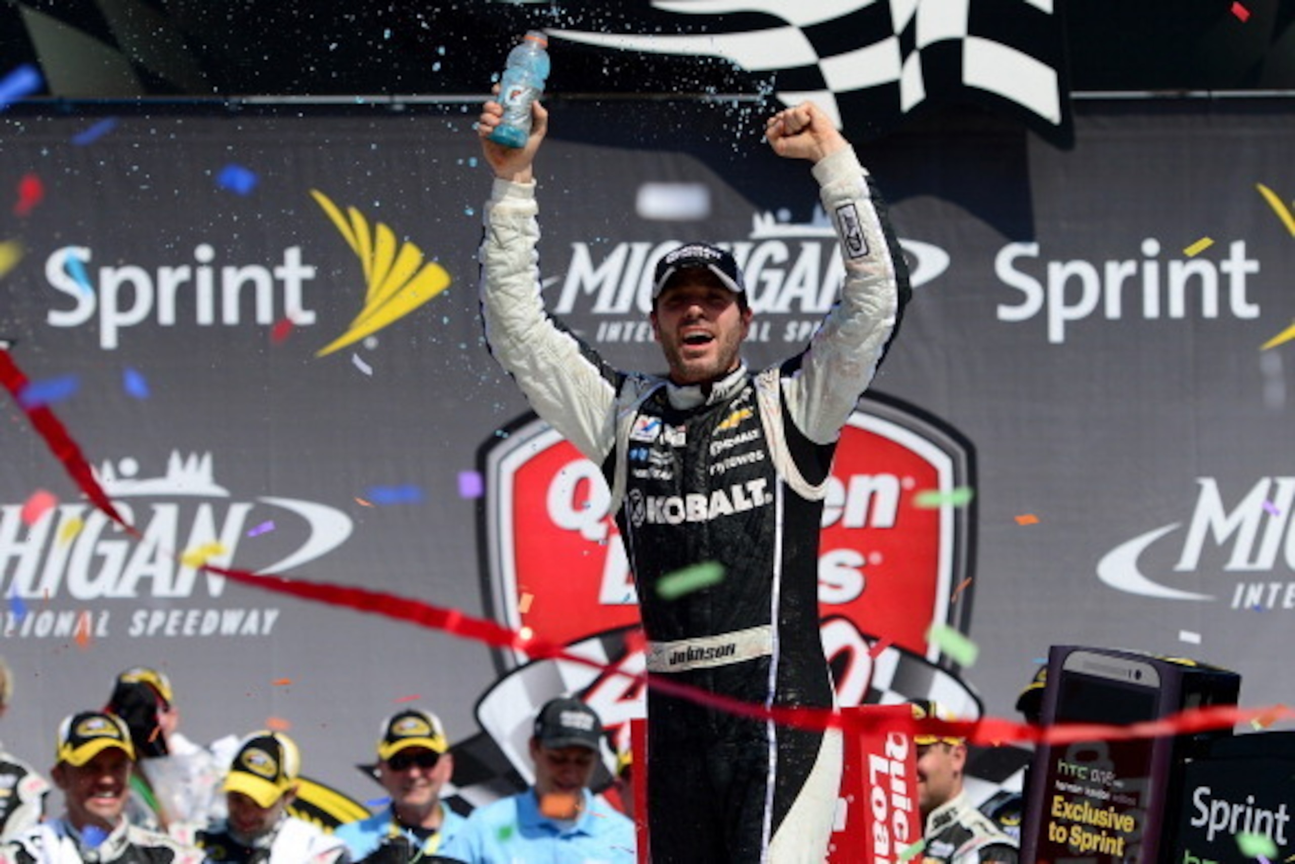 BROOKLYN, MI - JUNE 15:  Jimmie Johnson, driver of the #48 Lowe's/Kobalt Tools Chevrolet, celebrates in Victory Lane after winning the NASCAR Sprint Cup Series Quicken Loans 400 at Michigan International Speedway on June 15, 2014 in Brooklyn, Michigan.  (