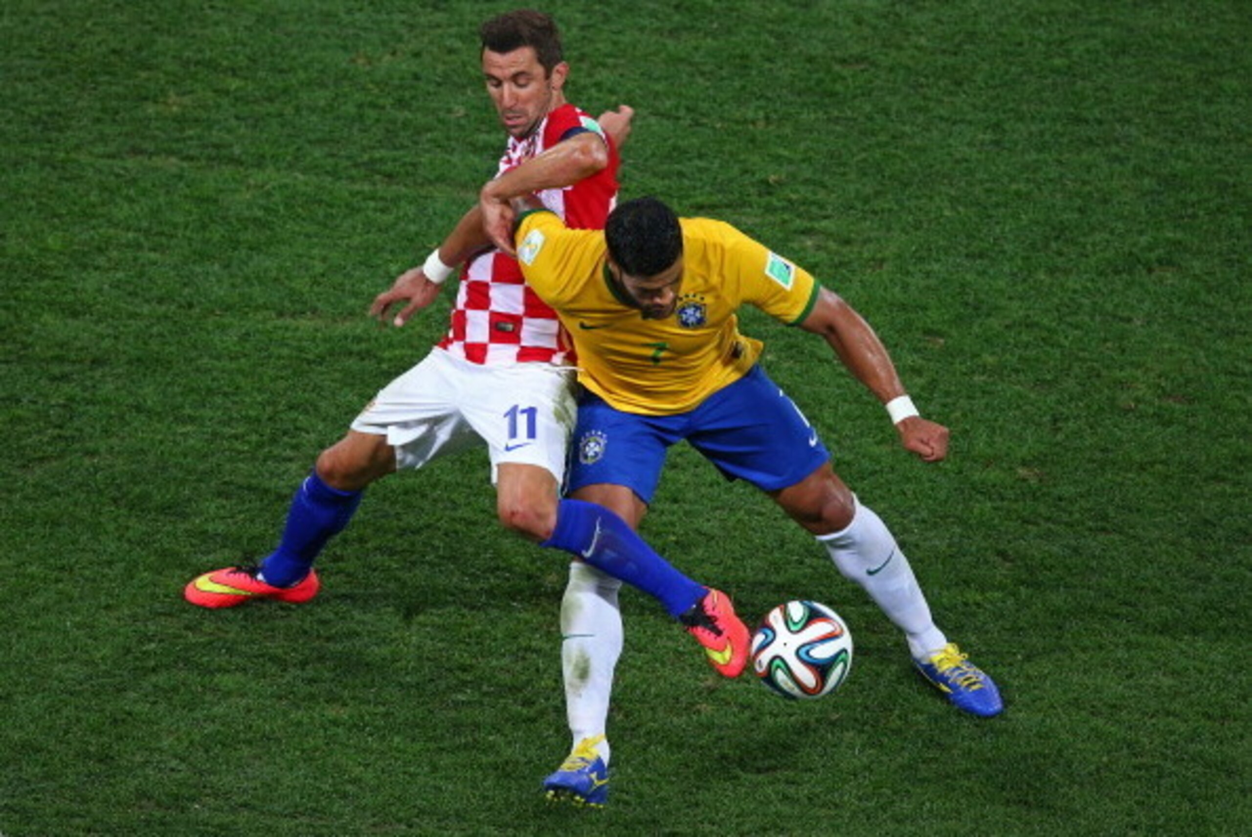 SAO PAULO, BRAZIL - JUNE 12: Hulk of Brazil fights off a challenge by Darijo Srna of Croatia during the 2014 FIFA World Cup Brazil Group A match between Brazil and Croatia at Arena de Sao Paulo on June 12, 2014 in Sao Paulo, Brazil. (Photo by Elsa/Getty SAO PAULO, BRAZIL - JUNE 12: Hulk of Brazil fights off a challenge by Darijo Srna of Croatia during the 2014 FIFA World Cup Brazil Group A match between Brazil and Croatia at Arena de Sao Paulo on June 12, 2014 in Sao Paulo, Brazil. (Photo by Elsa/Getty