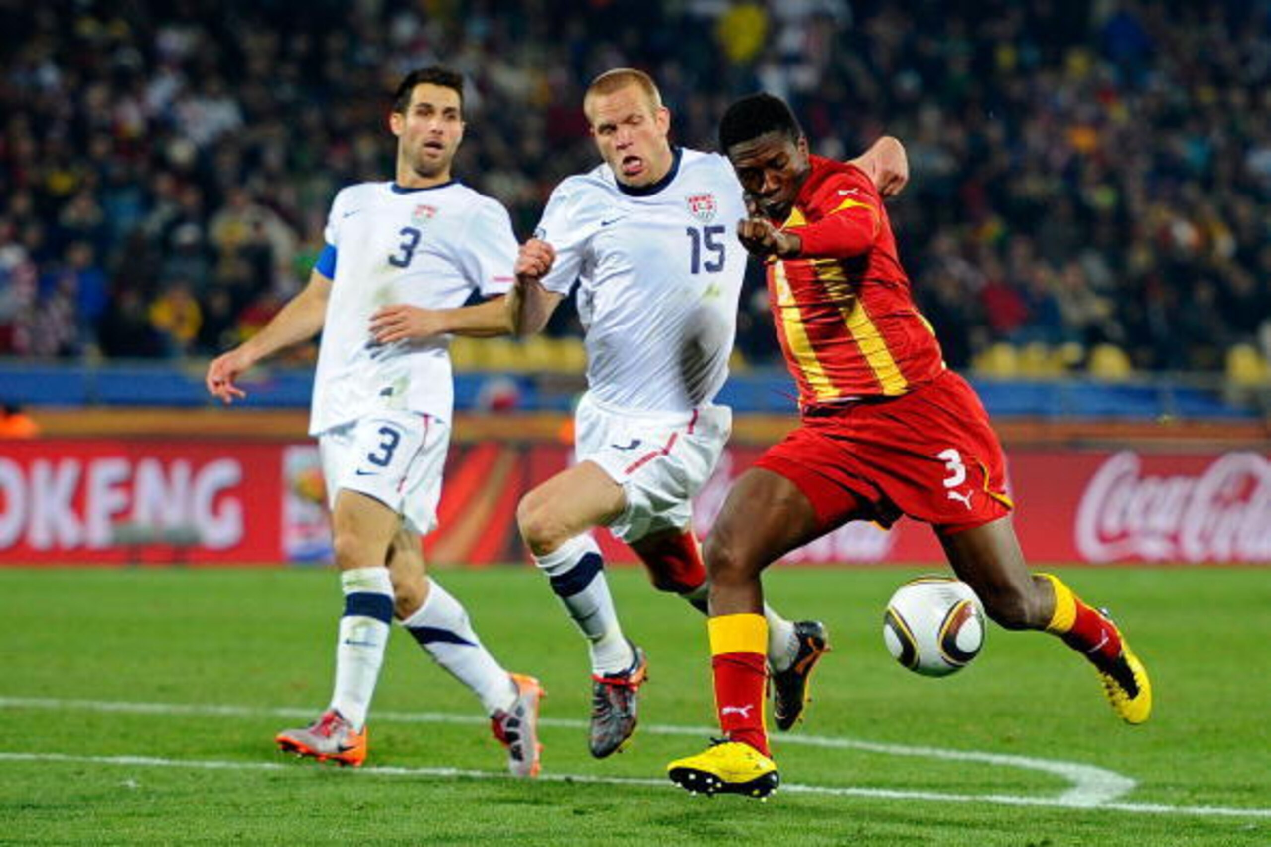 RUSTENBURG, SOUTH AFRICA - JUNE 26:  Jay Demerit of the United States fails to stop Asamoah Gyan of Ghana scoring his team's second goal in extra time during the 2010 FIFA World Cup South Africa Round of Sixteen match between USA and Ghana at Royal Bafoke