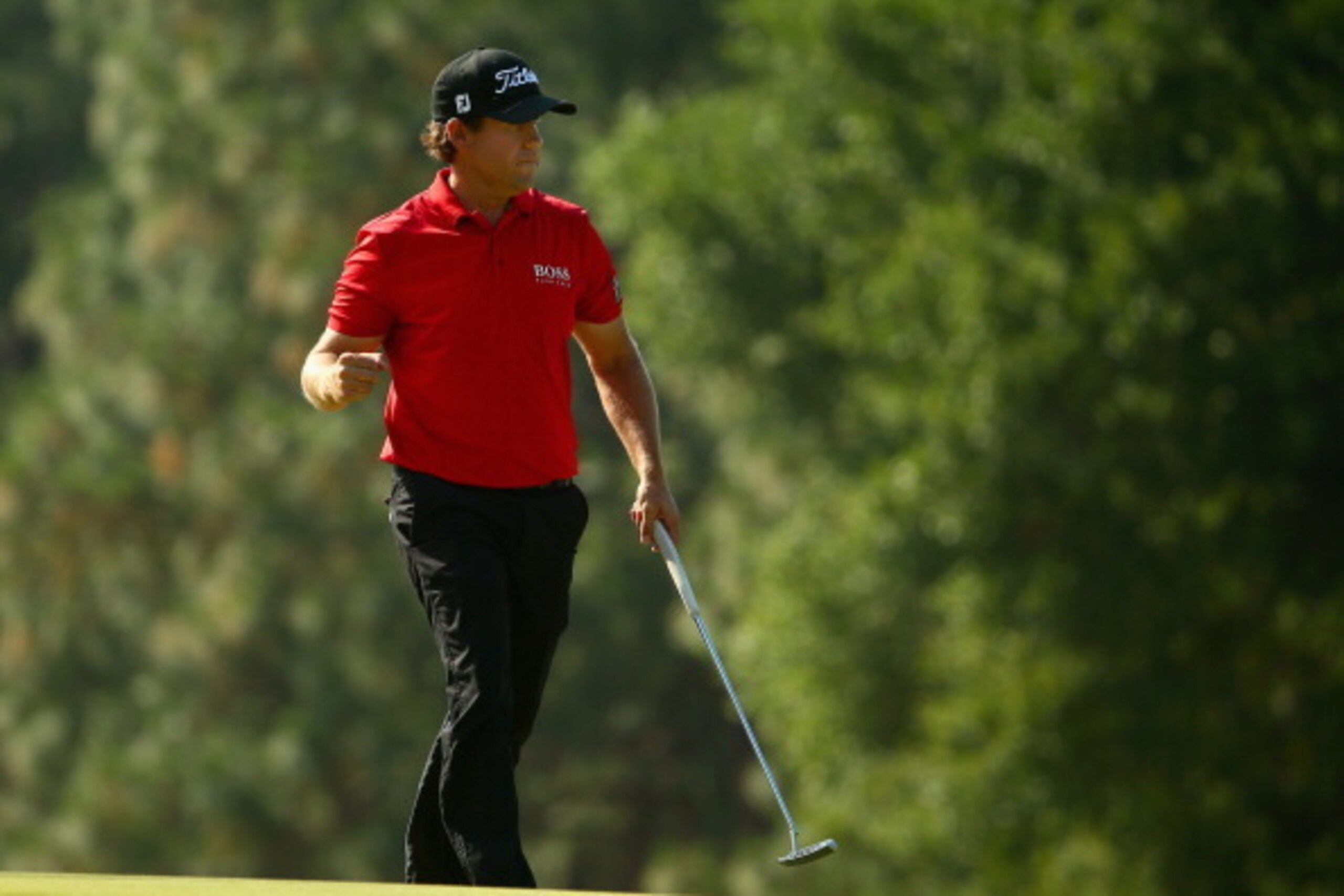 PINEHURST, NC - JUNE 15:  Erik Compton of the United States reacts to making a putt for birdie on the eighth hole during the final round of the 114th U.S. Open at Pinehurst Resort & Country Club, Course No. 2 on June 15, 2014 in Pinehurst, North Carolina.