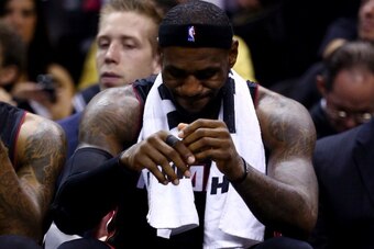 SAN ANTONIO, TX - JUNE 15:  LeBron James #6 of the Miami Heat reacts on the bench against the San Antonio Spurs during Game Five of the 2014 NBA Finals at the AT&T Center on June 15, 2014 in San Antonio, Texas. NOTE TO USER: User expressly acknowledges an