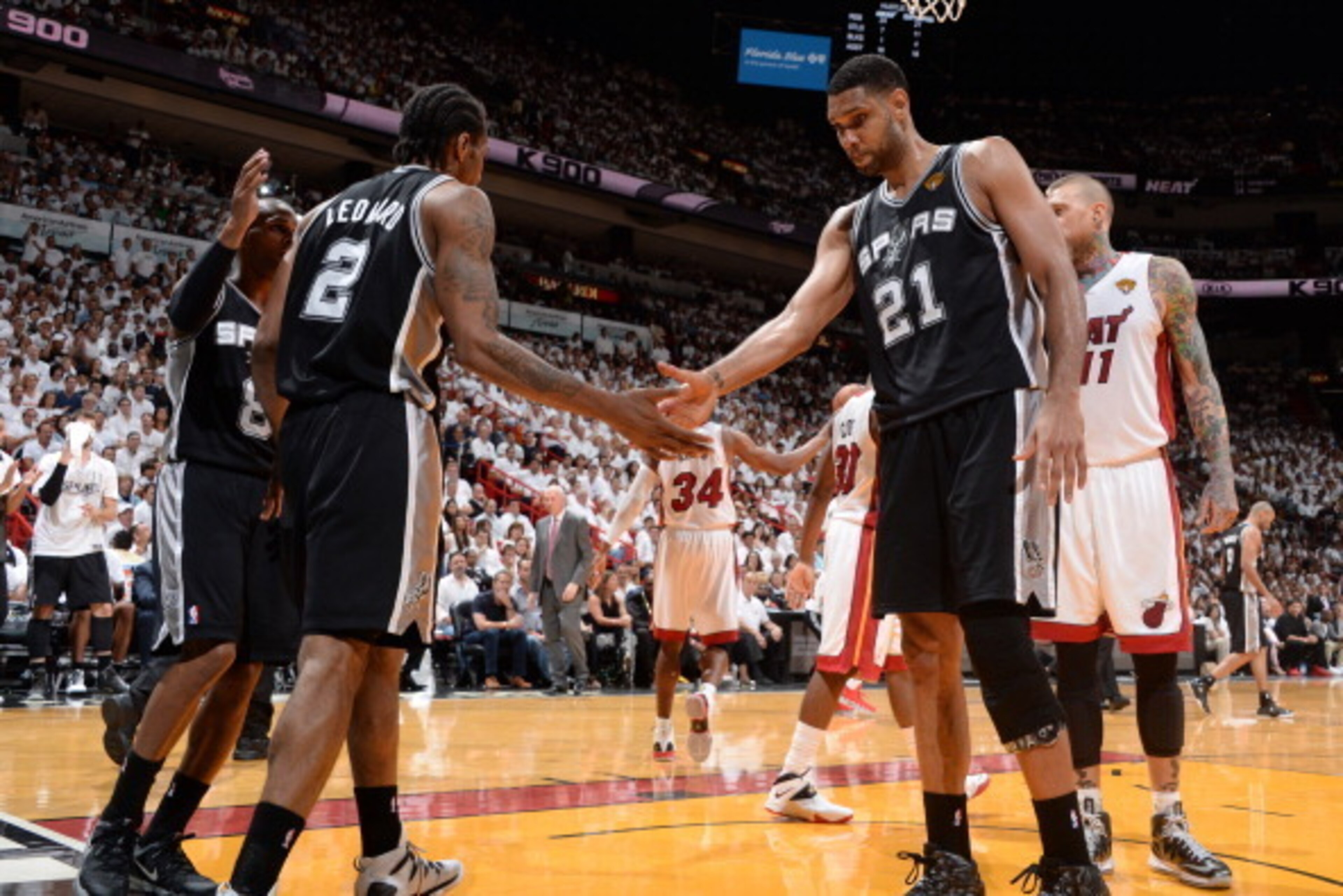MIAMI, FL - JUNE 10: Kawhi Leonard #2 and Tim Duncan #21 of the San Antonio Spurs high five during Game Three of the 2014 NBA Finals between the Miami Heat and San Antonio Spurs at the American Airlines Arena on June 10, 2014 in Miami, Florida. NOTE TO US