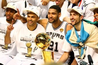 SAN ANTONIO, TX - JUNE 15:  Tony Parker #9 and Tim Duncan #21, and Manu Ginobili #20 of the San Antonio Spurs celebrate after defeating the Miami Heat in Game Five of the 2014 NBA Finals at the AT&T Center on June 15, 2014 in San Antonio, Texas. NOTE TO U