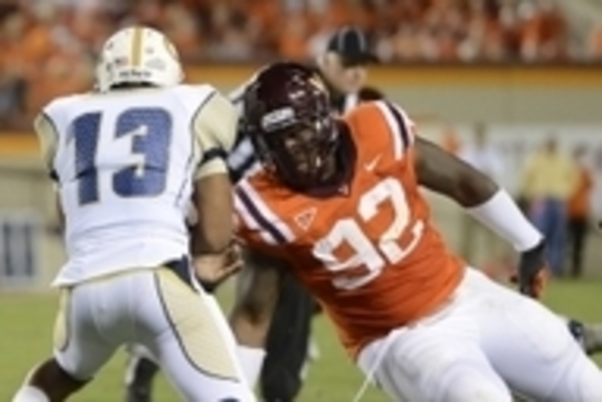 Spt 3, 2012; Blacksburg, VA, USA; Virginia Tech Hokies defensive tackle Luther Maddy (92) tackles Georgia Tech Yellow Jackets quarterback Tevin Washington (13) for a loss in the second quarter at Lane Stadium. Mandatory Credit: Bob Donnan-USA TODAY Sports