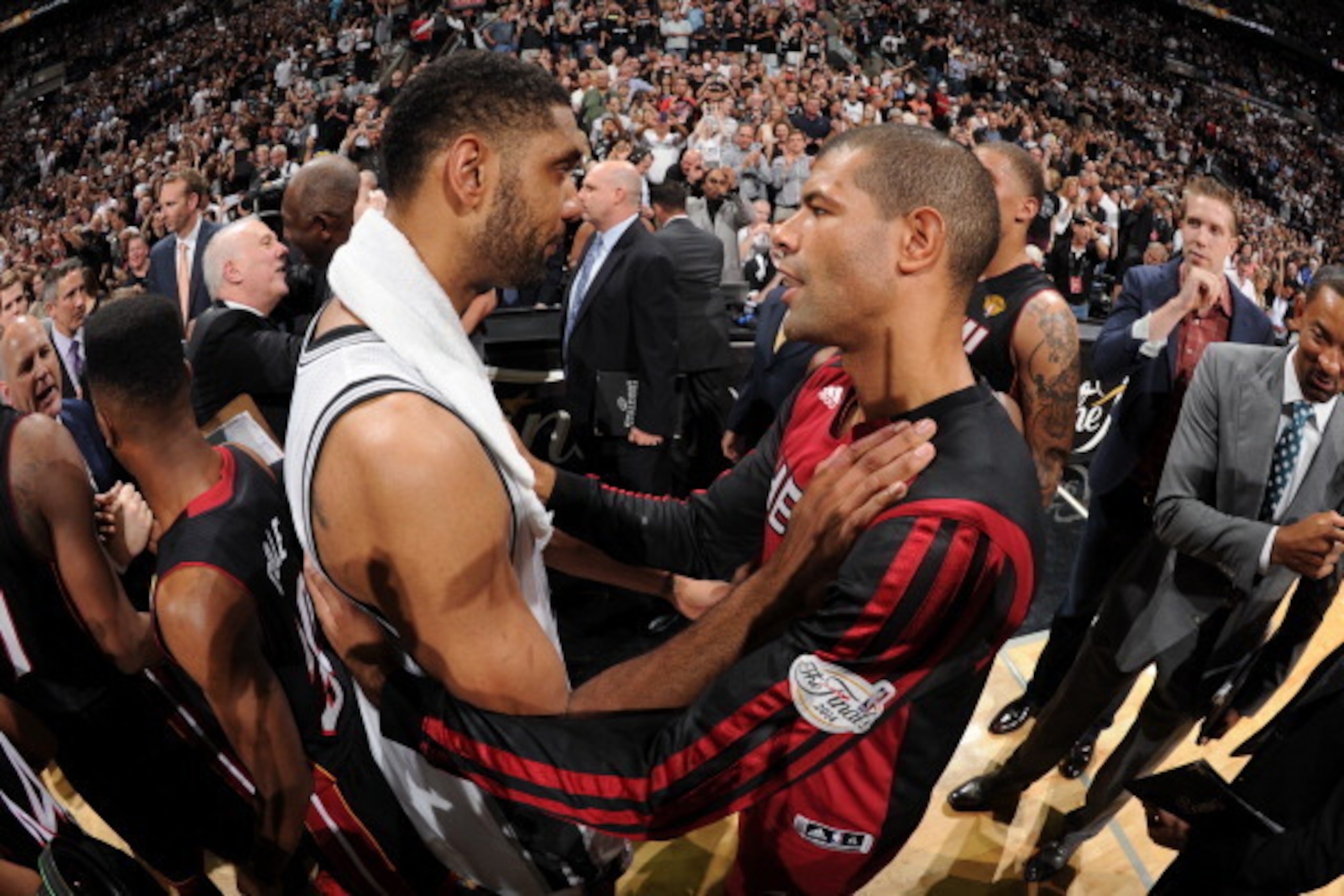 SAN ANTONIO, TX - JUNE 15: Tim Duncan #21 of the San Antonio Spurs and Shane Battier #31 of the Miami Heat embrace after the San Antonio Spurs victory in Game Five to win the 2014 NBA Finals between the Miami Heat and San Antonio Spurs at AT&T Center on J