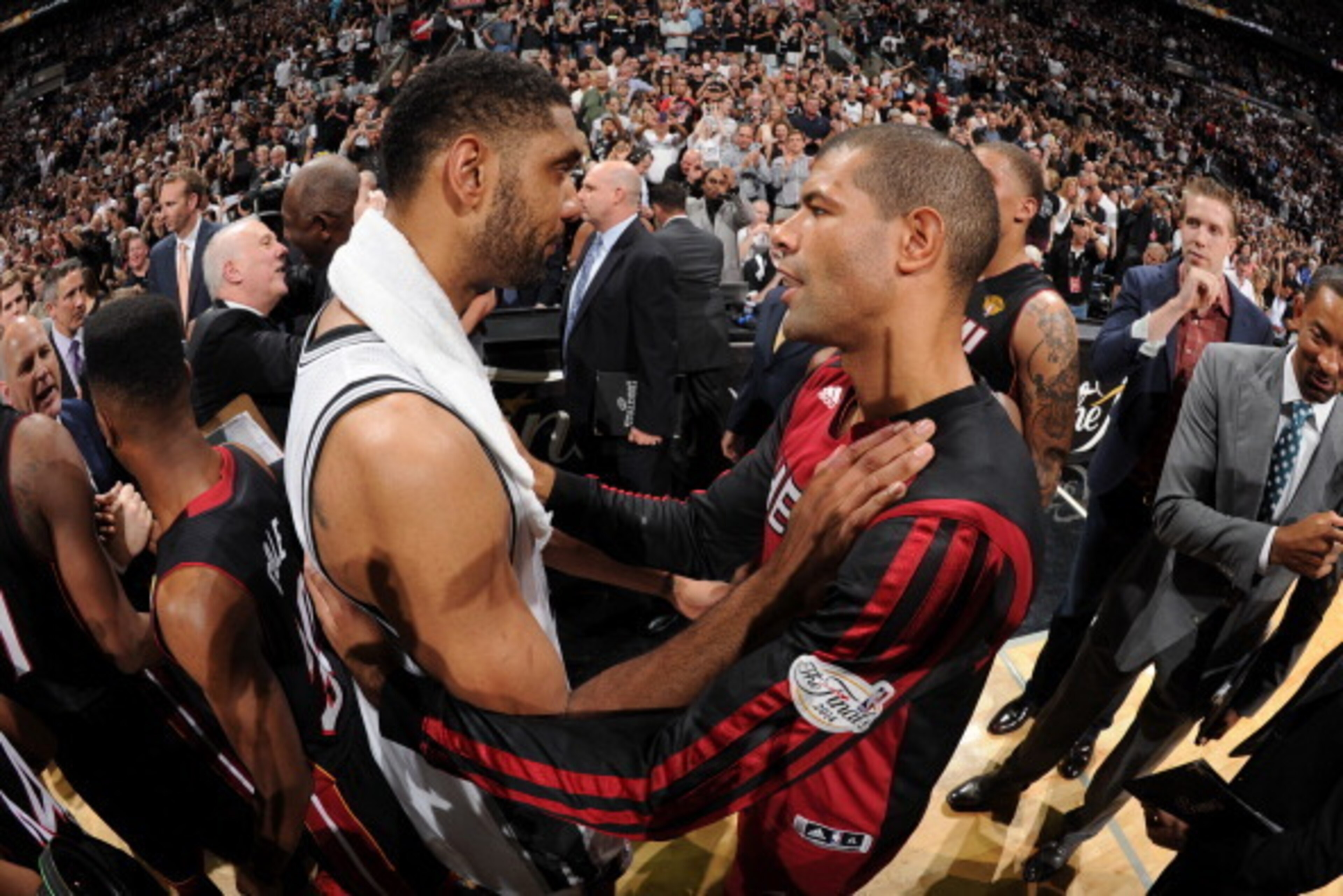SAN ANTONIO, TX - JUNE 15: Tim Duncan #21 of the San Antonio Spurs and Shane Battier #31 of the Miami Heat embrace after the San Antonio Spurs victory in Game Five to win the 2014 NBA Finals between the Miami Heat and San Antonio Spurs at AT&T Center on J