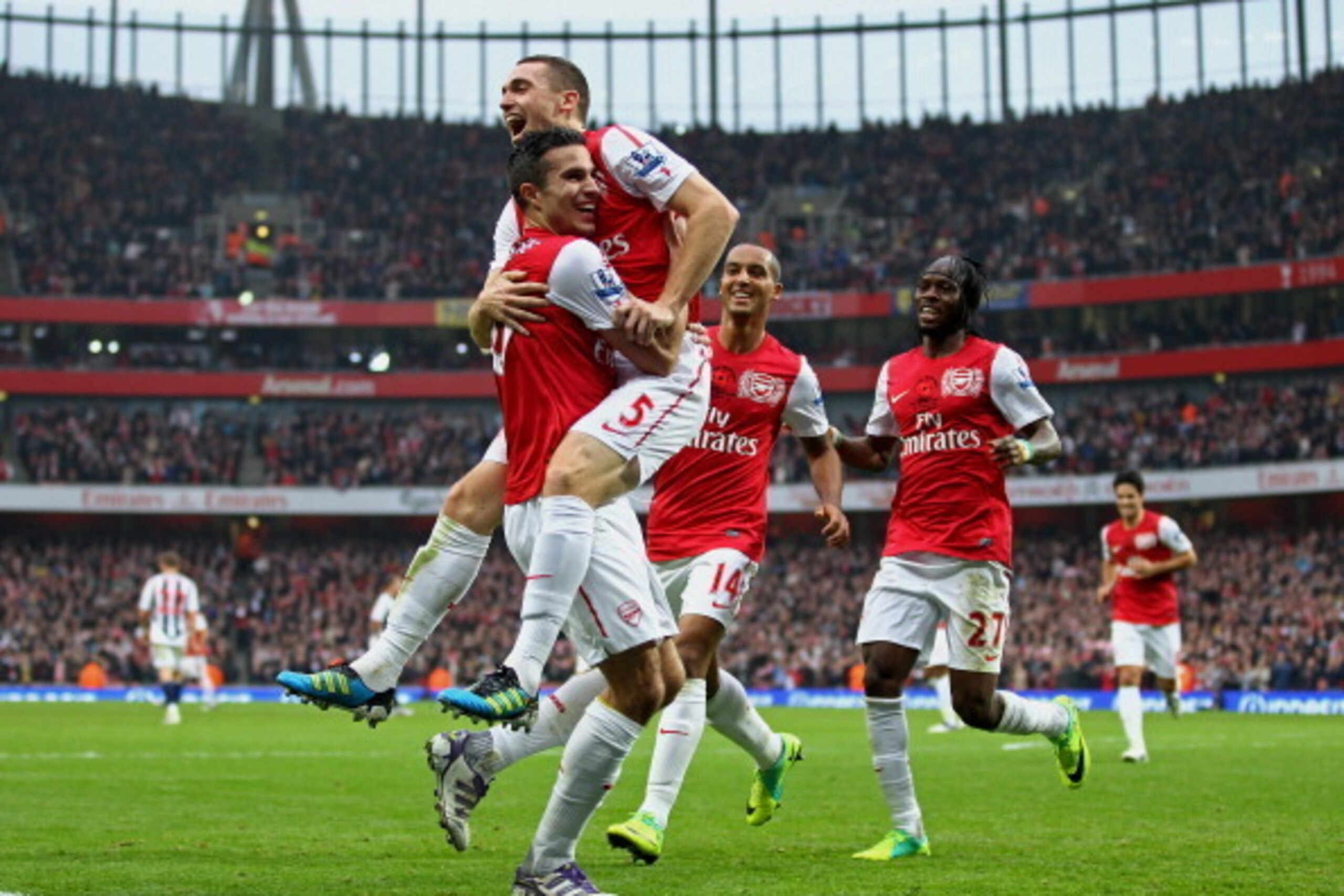 LONDON, ENGLAND - NOVEMBER 05:  Thomas Vermaelen #5 of Arsenal celebrates with teammate Robin van Persie (L) after scoring his team's second goal during the Barclays Premier League match between Arsenal and West Bromwich Albion at Emirates Stadium on Nove