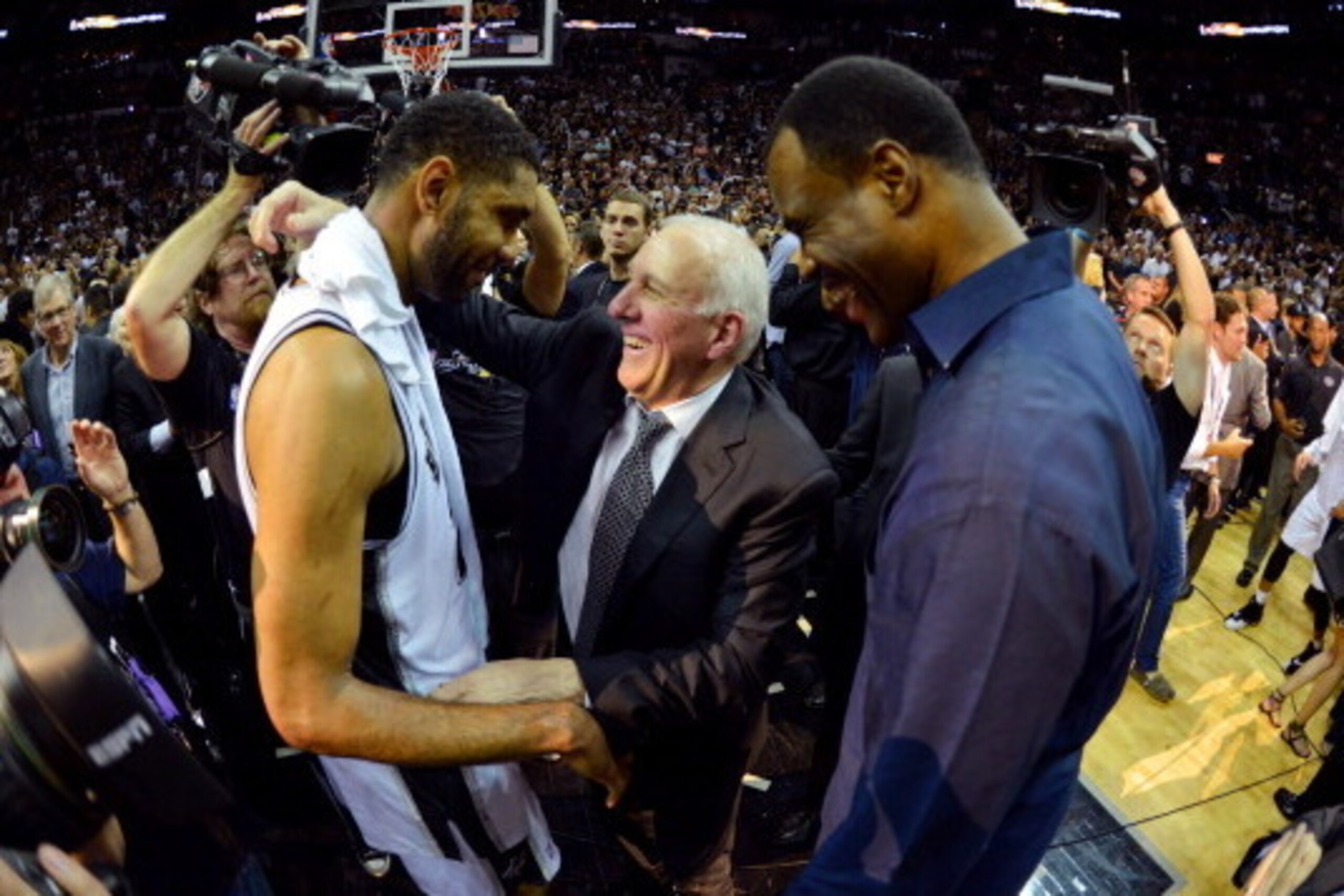 SAN ANTONIO, TX - JUNE 15: NBA Legend David Robinson greets head coach Gregg Popovich and Tim Duncan #21 of the San Antonio Spurs after a win against the Miami Heat in Game Five of the 2014 NBA Finals on June 15, 2014 at AT&T Center in San Antonio, Texas. SAN ANTONIO, TX - JUNE 15: NBA Legend David Robinson greets head coach Gregg Popovich and Tim Duncan #21 of the San Antonio Spurs after a win against the Miami Heat in Game Five of the 2014 NBA Finals on June 15, 2014 at AT&T Center in San Antonio, Texas.