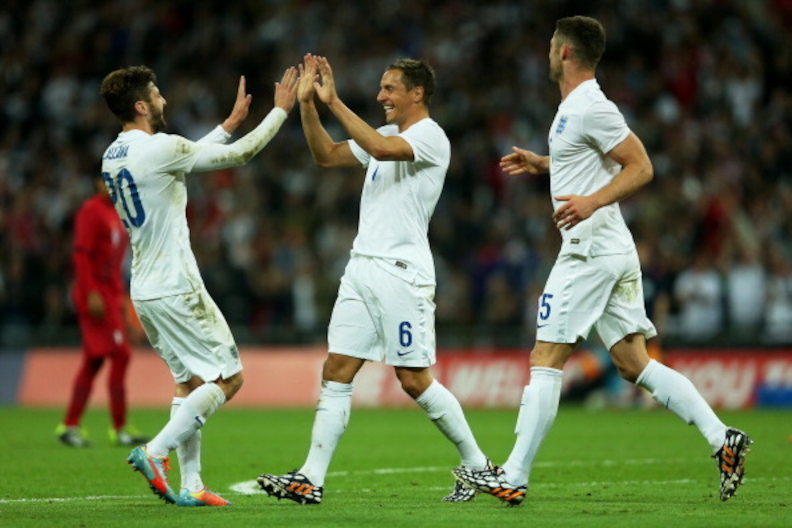 LONDON, ENGLAND - MAY 30:  Phil Jagielka of England celebrates scoring the third goal with Adam Lallana and Gary Cahill of England during the international friendly match between England and Peru at Wembley Stadium on May 30, 2014 in London, England.  (Ph