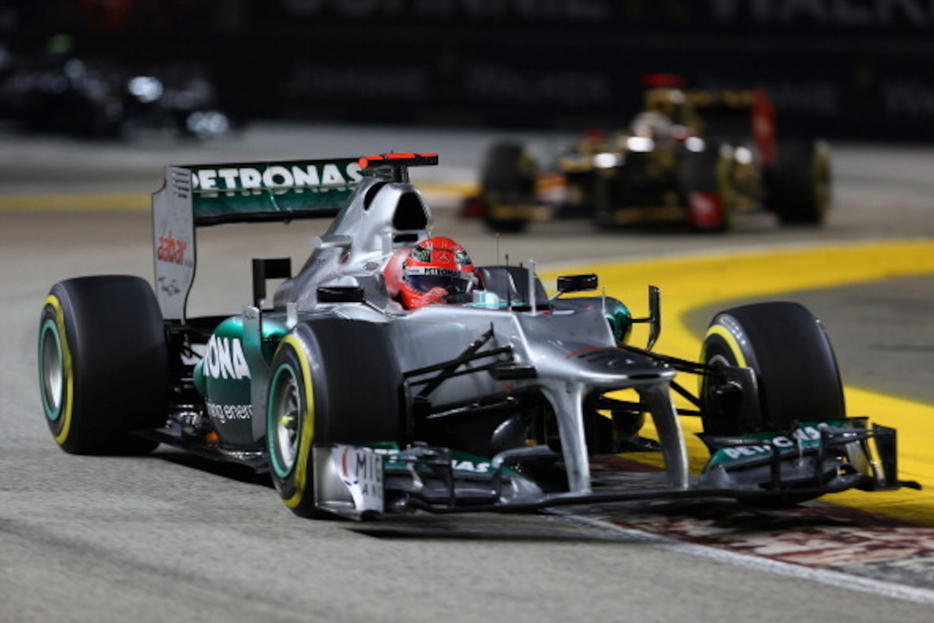 SINGAPORE - SEPTEMBER 23:  Michael Schumacher of Germany and Mercedes GP drives during the Singapore Formula One Grand Prix at the Marina Bay Street Circuit on September 23, 2012 in Singapore, Singapore.  (Photo by Clive Mason/Getty Images)