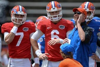 Florida QB Jeff Driskel (middle) and new offensive coordinator Kurt Roper (right)