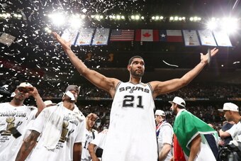 SAN ANTONIO, TX - JUNE 15: Tim Duncan #21 of the San Antonio Spurs reacts with teammates after winning 2014 NBA Finals at AT&T Center on June 15, 2014 in San Antonio, Texas. NOTE TO USER: User expressly acknowledges and agrees that, by downloading and/or 