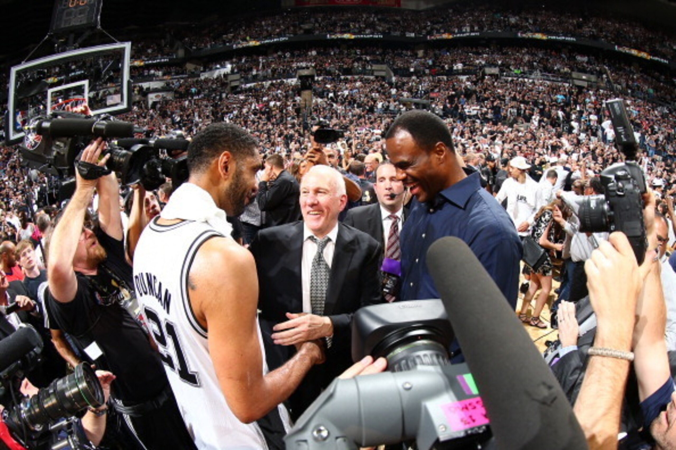 SAN ANTONIO, TX - JUNE 15: Tim Duncan #21 of the San Antonio Spurs, Head Coach Gregg Popovich and NBA Legend David Robinson after NBA Finals victory during Game Five of the 2014 NBA Finals at AT&T Center on June 15, 2014 in San Antonio, Texas. NOTE TO USE