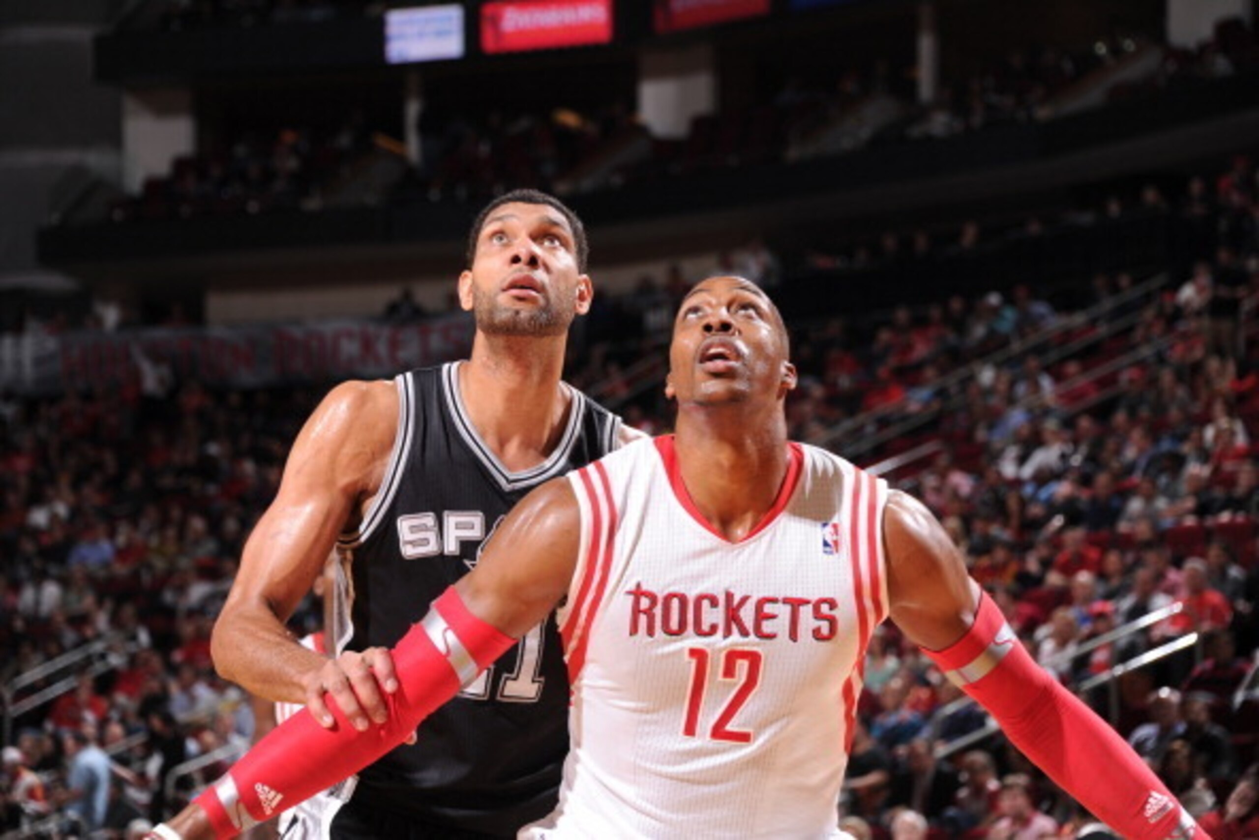 HOUSTON, TX - APRIL 14: Dwight Howard #12 of the Houston Rockets boxes out Tim Duncan #21 of the San Antonio Spurs during the game on April 14, 2014 at the Toyota Center in Houston, Texas. NOTE TO USER: User expressly acknowledges and agrees that, by down