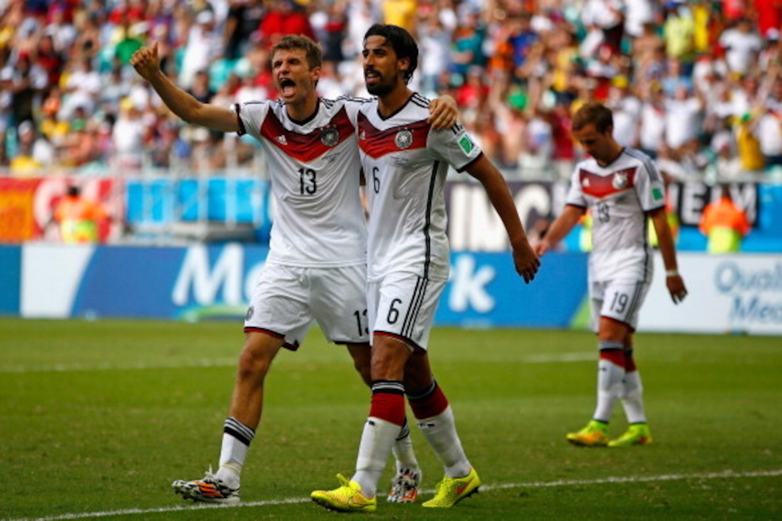 SALVADOR, BRAZIL - JUNE 16:  Thomas Mueller of Germany (L) celebrates scoring his team's fourth goal and completing his hat trick with Sami Khedira during the 2014 FIFA World Cup Brazil Group G match between Germany and Portugal at Arena Fonte Nova on Jun