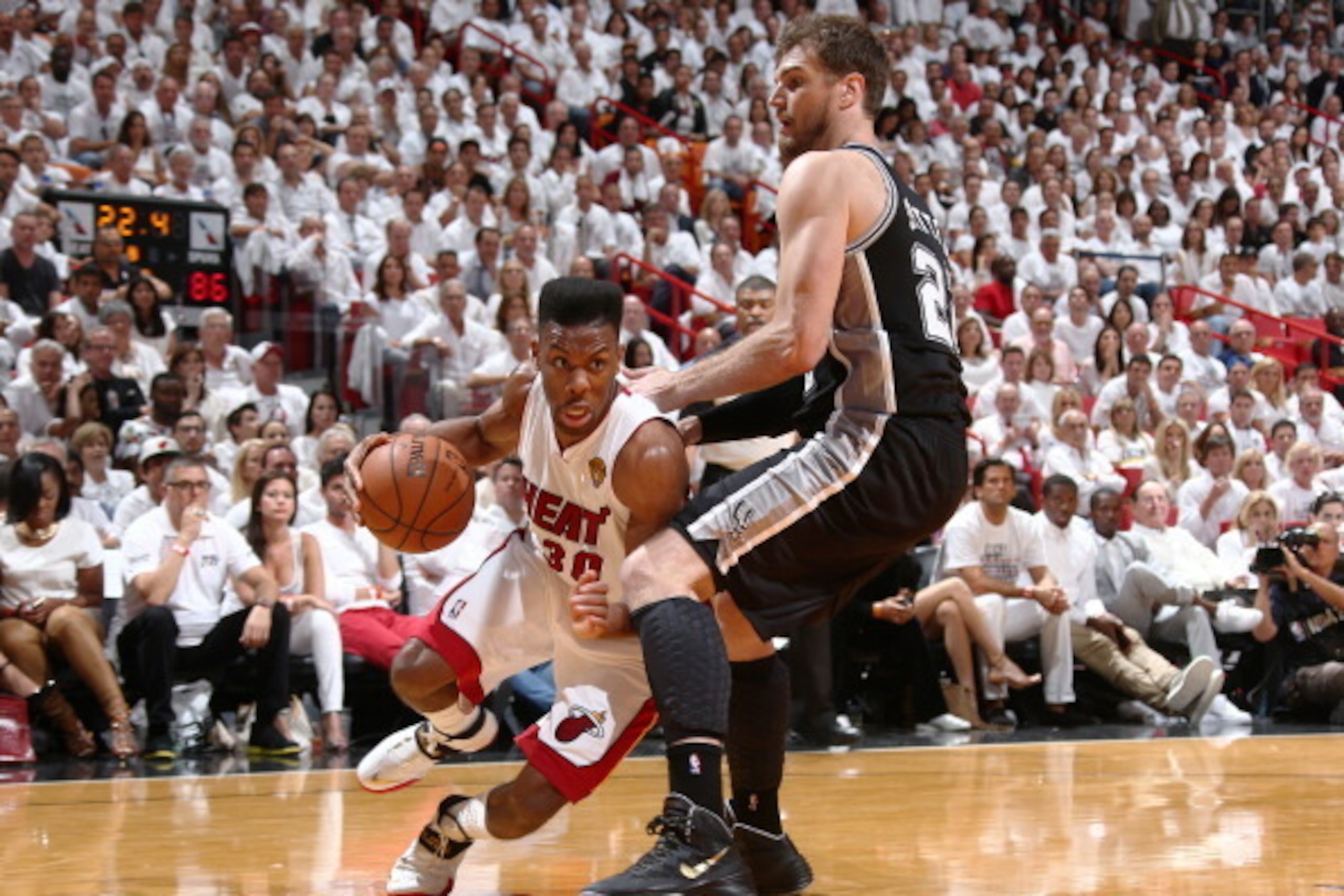 MIAMI, FL - JUNE 10: Norris Cole #30 of the Miami Heat drives against Thiago Splitter #22 of the San Antonio Spurs during Game Three of the 2014 NBA Finals at American Airlines Arena in Miami, Florida on June 10, 2014.  NOTE TO USER: User expressly acknow