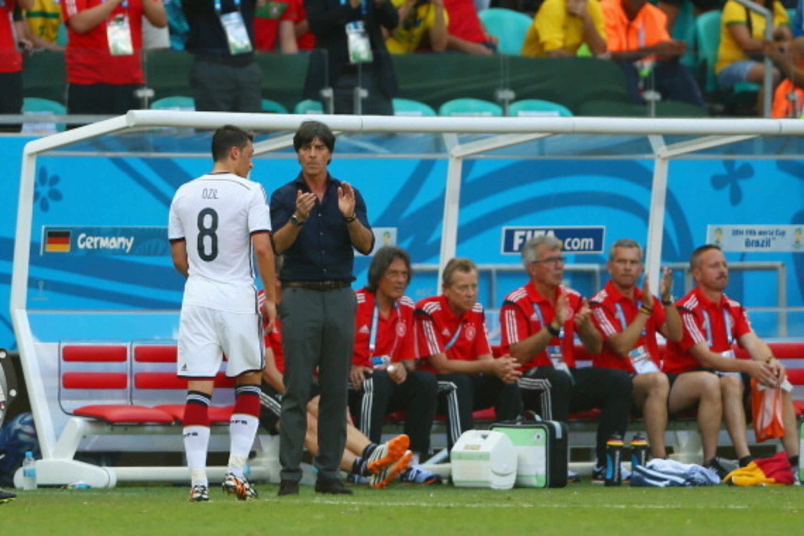 SALVADOR, BRAZIL - JUNE 16: Head coach Joachim Loew of Germany claps as Mesut Oezil exits the match during the 2014 FIFA World Cup Brazil Group G match between Germany and Portugal at Arena Fonte Nova on June 16, 2014 in Salvador, Brazil.  (Photo by Clive