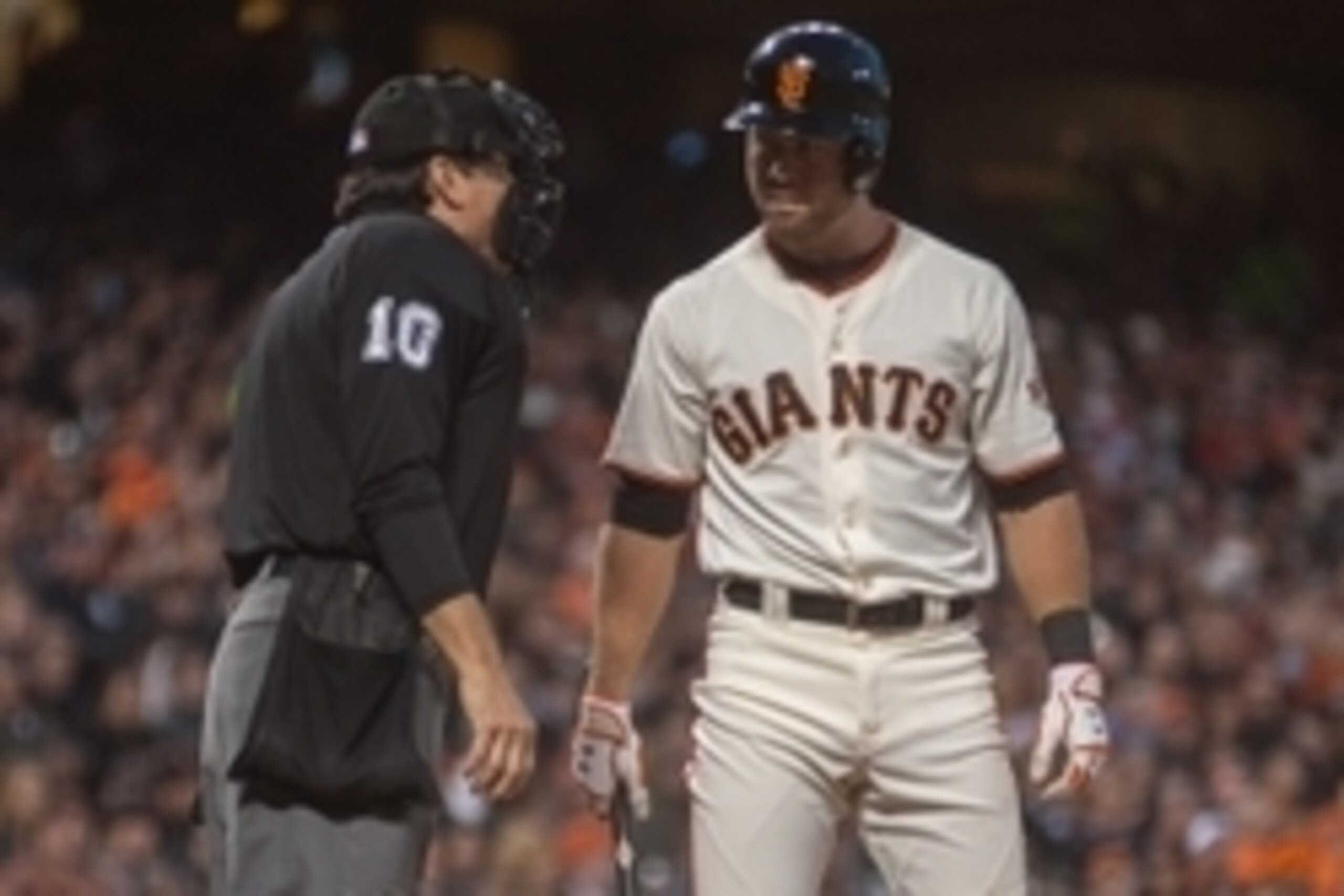 Jun 11, 2014; San Francisco, CA, USA; San Francisco Giants second baseman Brandon Hicks (14) argues a call with umpire Phil Cuzzi (10) during the fourth inning against the Washington Nationals at AT&T Park. Mandatory Credit: Ed Szczepanski-USA TODAY Sport
