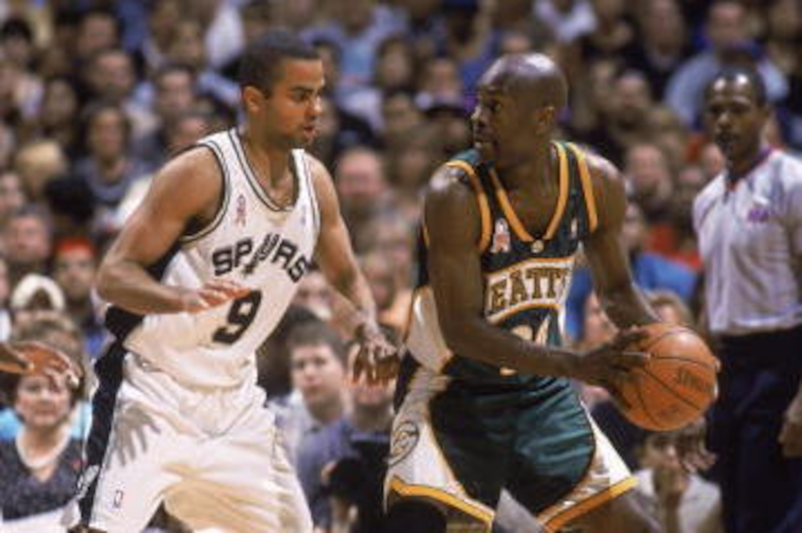 SAN ANTONIO - MAY 3:  Gary Payton #20 of the Seattle SuperSonics posts up Tony Parker #9 of the San Antonio Spurs, during game 5 of the Western Conference quarterfinals during the 2002 NBA Playoffs at the Alamadome in May 3, 2002. The Spurs won, 101-78.  