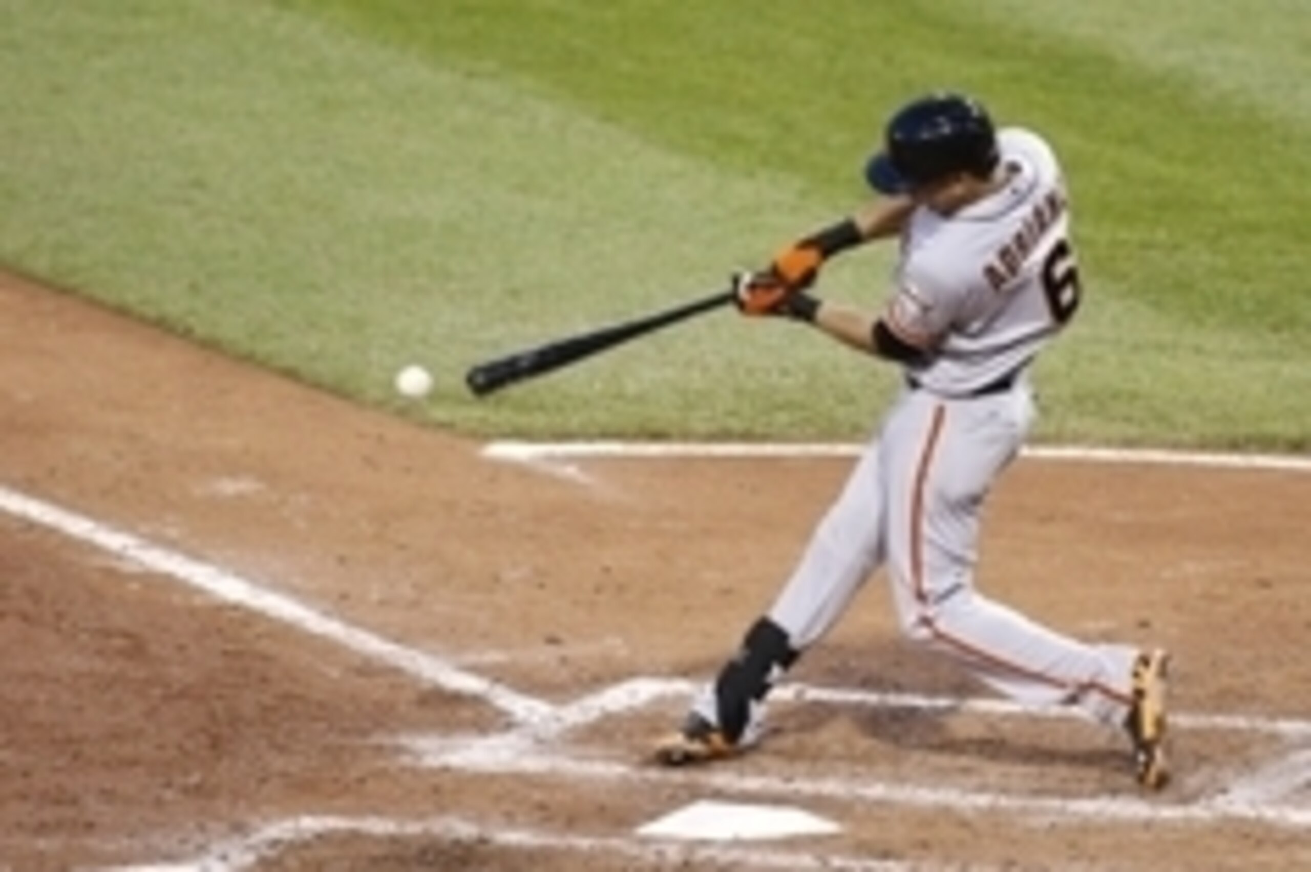 May 6, 2014; Pittsburgh, PA, USA; San Francisco Giants second baseman Ehire Adrianza (6) singles against the Pittsburgh Pirates during the fifth inning at PNC Park. The Pirates won 2-1. Mandatory Credit: Charles LeClaire-USA TODAY Sports