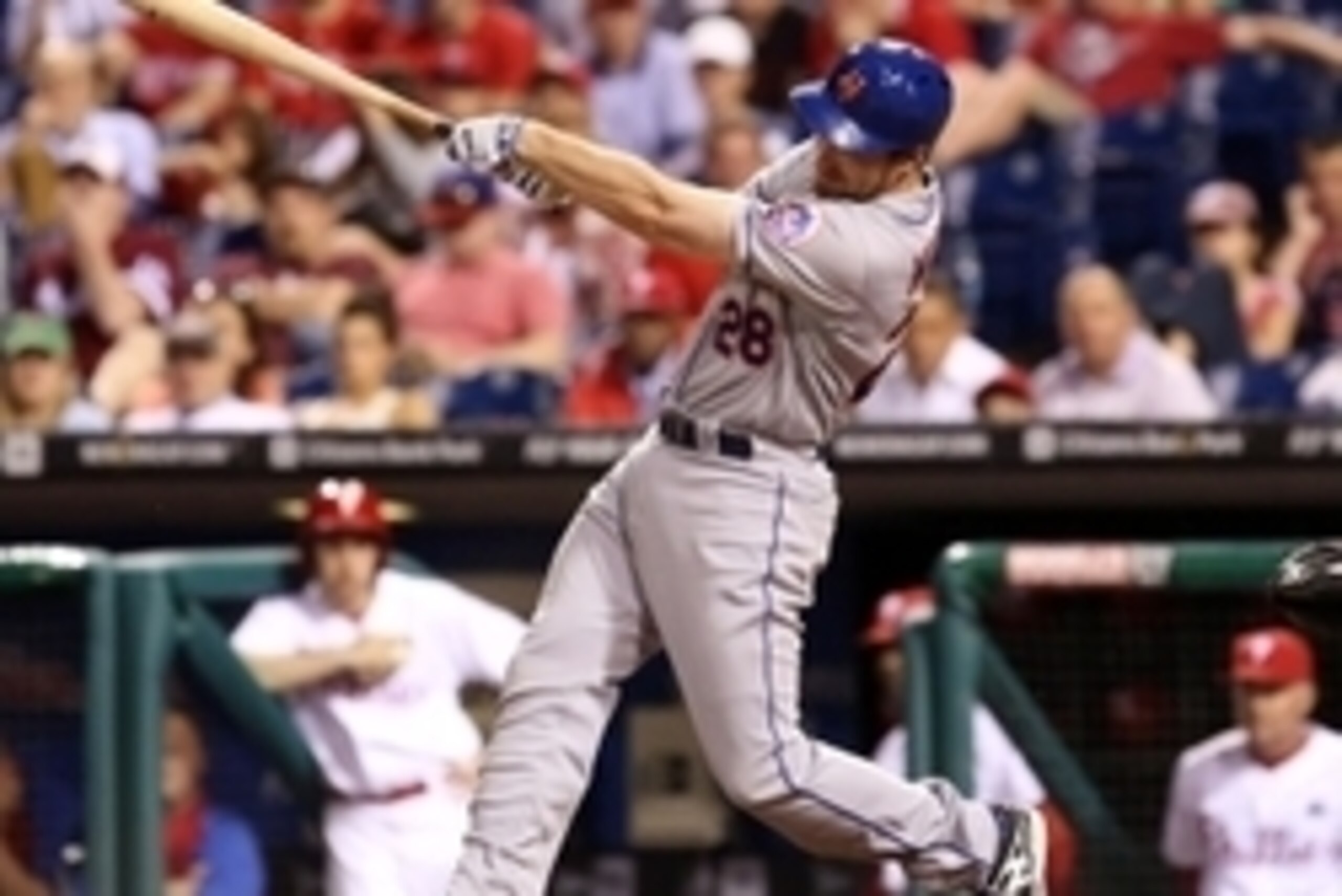 Jun 2, 2014; Philadelphia, PA, USA; New York Mets second baseman Daniel Murphy (28) singles to right during the sixth inning of a game against the Philadelphia Phillies at Citizens Bank Park. The Mets won 11-2. Mandatory Credit: Bill Streicher-USA TODAY S