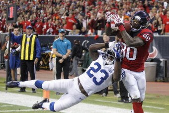 HOUSTON, TX - NOVEMBER 03:  Andre Johnson #80 of the Houston Texans grabs a five yard pass away from Vontae Davis #23 of the Indianapolis Colts for a touchdown in the second quarter at Reliant Stadium on November 3, 2013 in Houston, Texas.  (Photo by Bob 