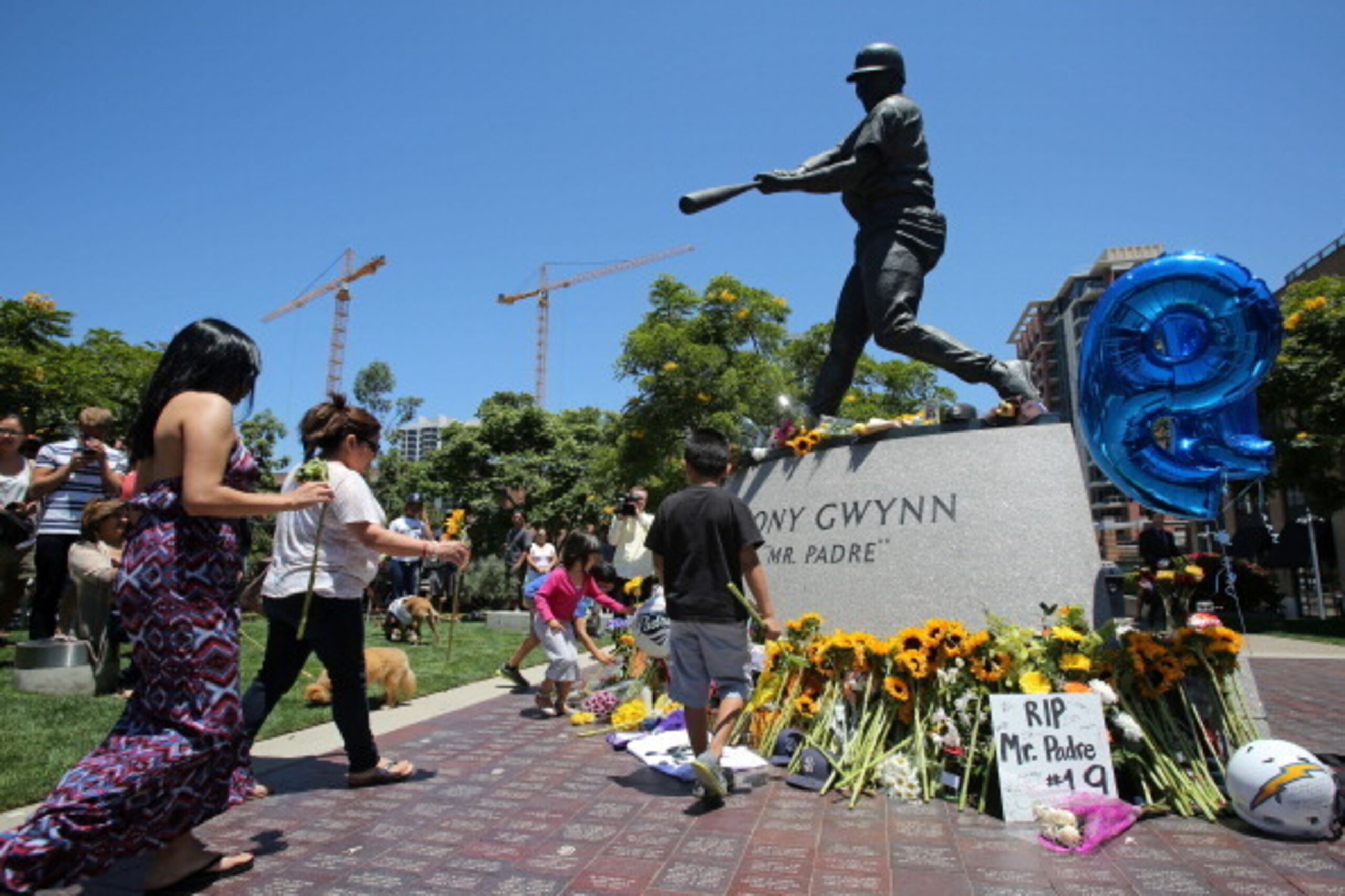 SAN DIEGO, CA - JUNE 16: Fans place flowers at the base of a statue of baseball great Tony Gwynn at Petco Park, where the San Diego Padres play, June 16, 2014 in San Diego, California. Gwynn died this morning after a lengthy battle with cancer, according SAN DIEGO, CA - JUNE 16: Fans place flowers at the base of a statue of baseball great Tony Gwynn at Petco Park, where the San Diego Padres play, June 16, 2014 in San Diego, California. Gwynn died this morning after a lengthy battle with cancer, according