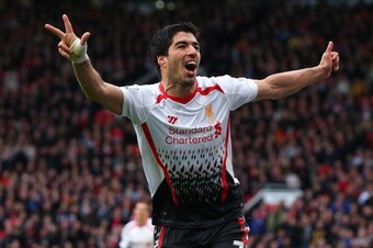 MANCHESTER, ENGLAND - MARCH 16:  Luis Suarez of Liverpool celebrates scoring his team's third goal during the Barclays Premier League match between Manchester United and Liverpool at Old Trafford on March 16, 2014 in Manchester, England.  (Photo by Alex L