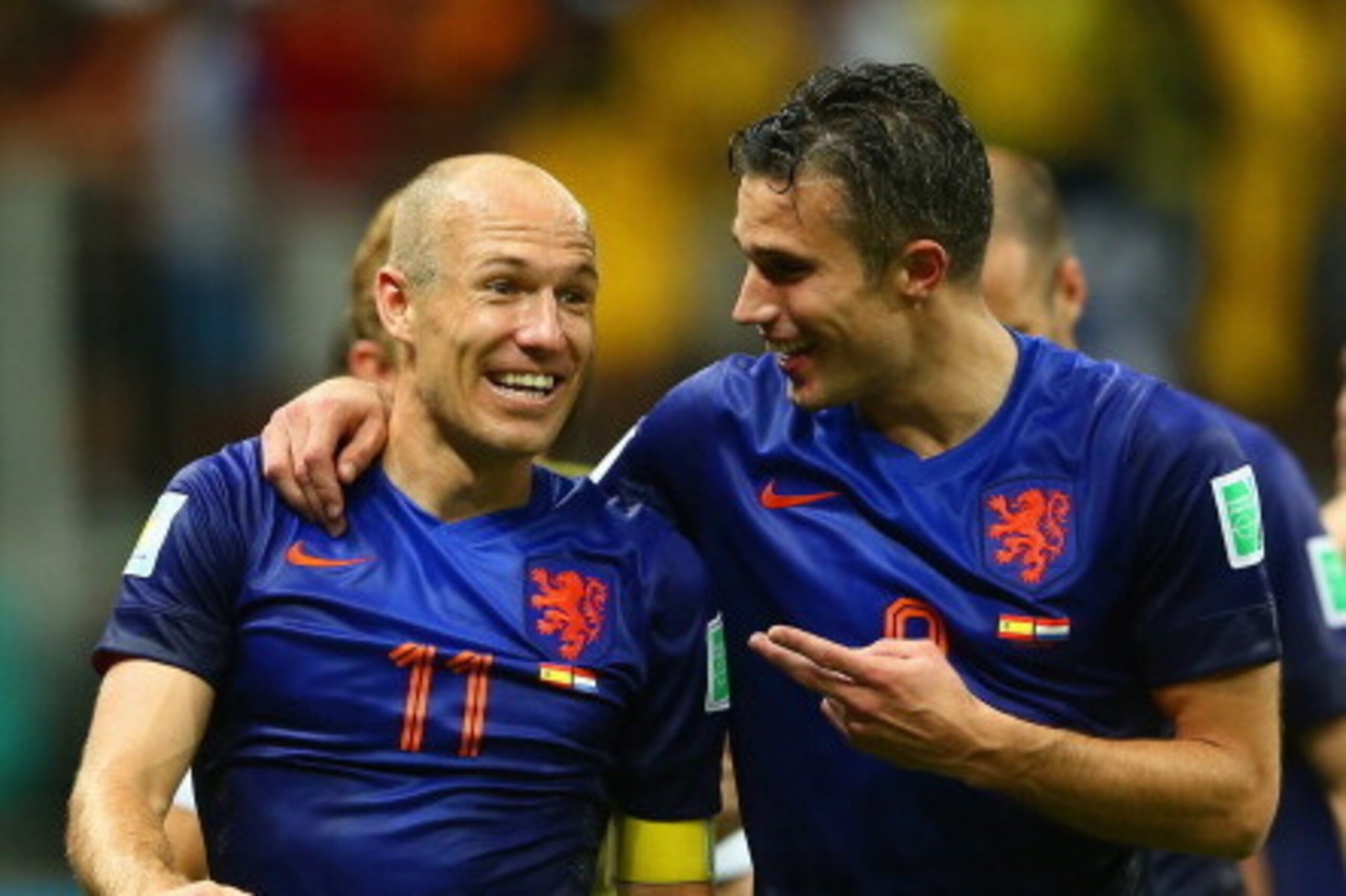 SALVADOR, BRAZIL - JUNE 13:  Arjen Robben (L) and Robin van Persie of the Netherlands walk off the field after scoring two goals each and defeating Spain 5-1 during the 2014 FIFA World Cup Brazil Group B match between Spain and Netherlands at Arena Fonte