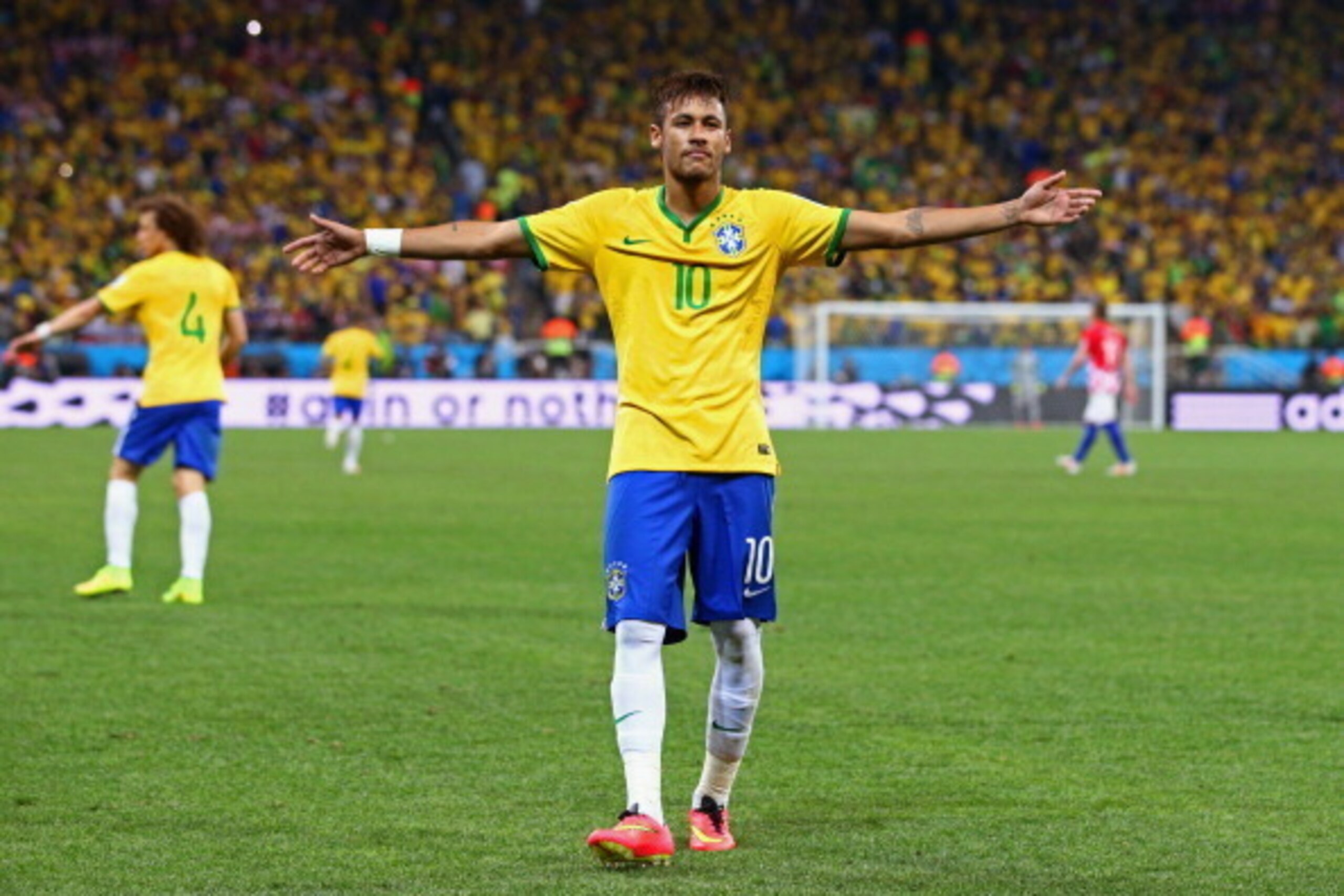 SAO PAULO, BRAZIL - JUNE 12:  Neymar of Brazil celebrates after scoring his second goal on a penalty kick in the second half during the 2014 FIFA World Cup Brazil Group A match between Brazil and Croatia at Arena de Sao Paulo on June 12, 2014 in Sao Paulo