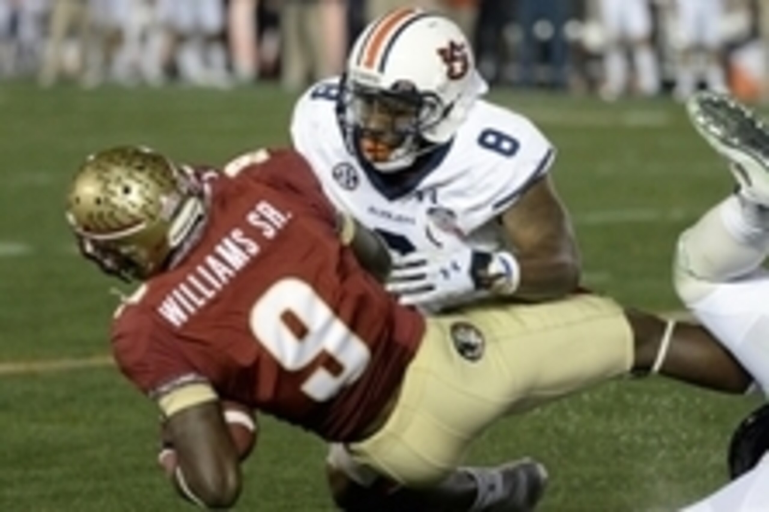Jan 6, 2014; Pasadena, CA, USA; Auburn Tigers linebacker Cassanova McKinzy (8) tackles Florida State Seminoles running back Karlos Williams (9) during the second half of the 2014 BCS National Championship game at the Rose Bowl. Mandatory Credit: Richard Jan 6, 2014; Pasadena, CA, USA; Auburn Tigers linebacker Cassanova McKinzy (8) tackles Florida State Seminoles running back Karlos Williams (9) during the second half of the 2014 BCS National Championship game at the Rose Bowl. Mandatory Credit: Richard