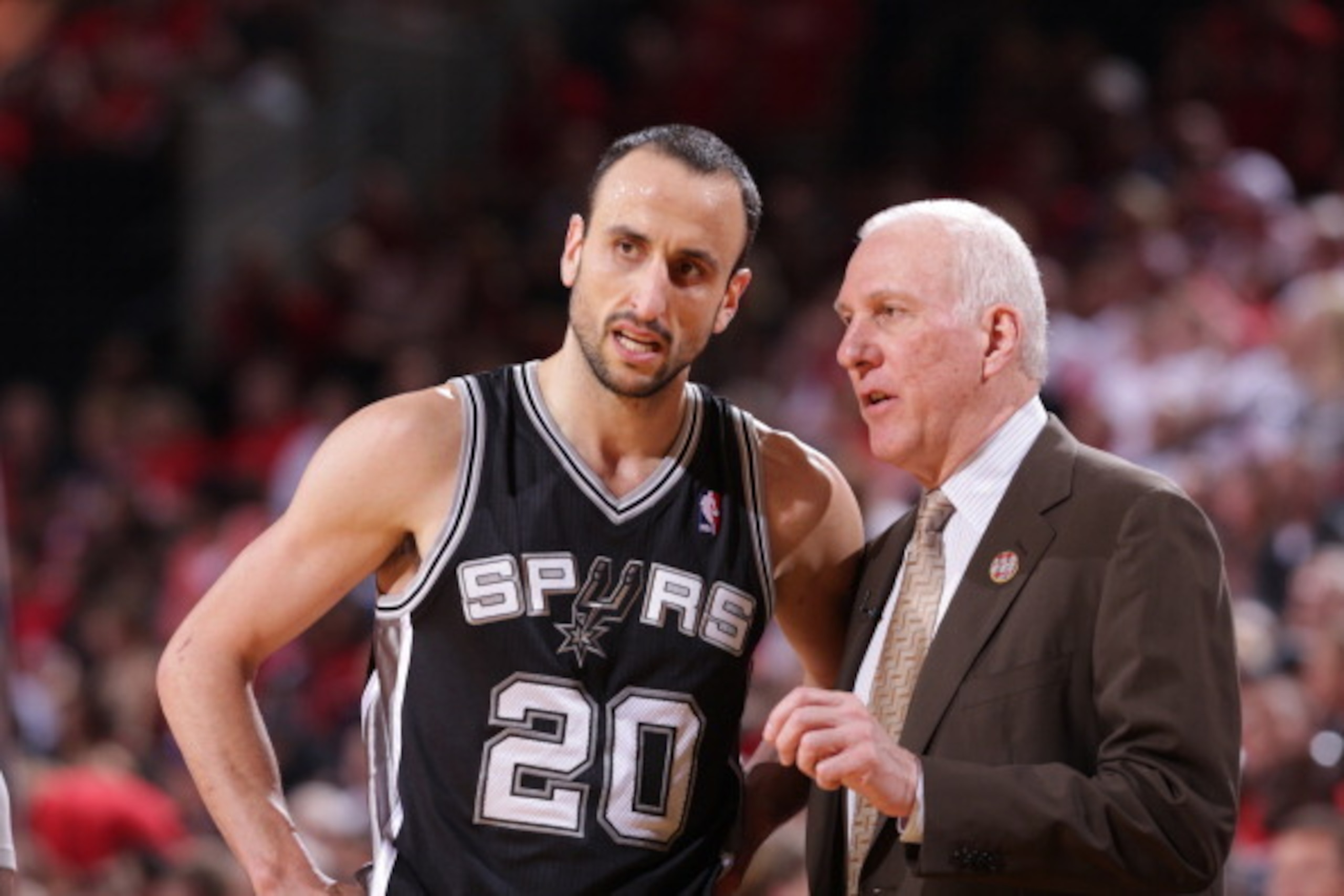 PORTLAND, OR - MAY 10:   Manu Ginobili #20 and Gregg Popovich of the San Antonio Spurs talk in Game Three of the Western Conference Semifinals against the Portland Trail Blazers during the 2014 NBA Playoffs on May 10, 2014 at the Moda Center in Portland, 