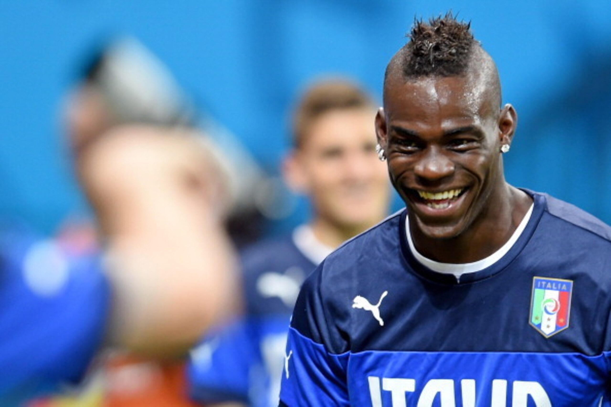MANAUS, BRAZIL - JUNE 13:  Mario Balotelli smiles during an Italy training session at the Arena Amazonia on June 13, 2014 in Manaus, Brazil. Italy will play England in their opening group D match on June 14, 2014 in Manaus, Brazil.  (Photo by Claudio Vill