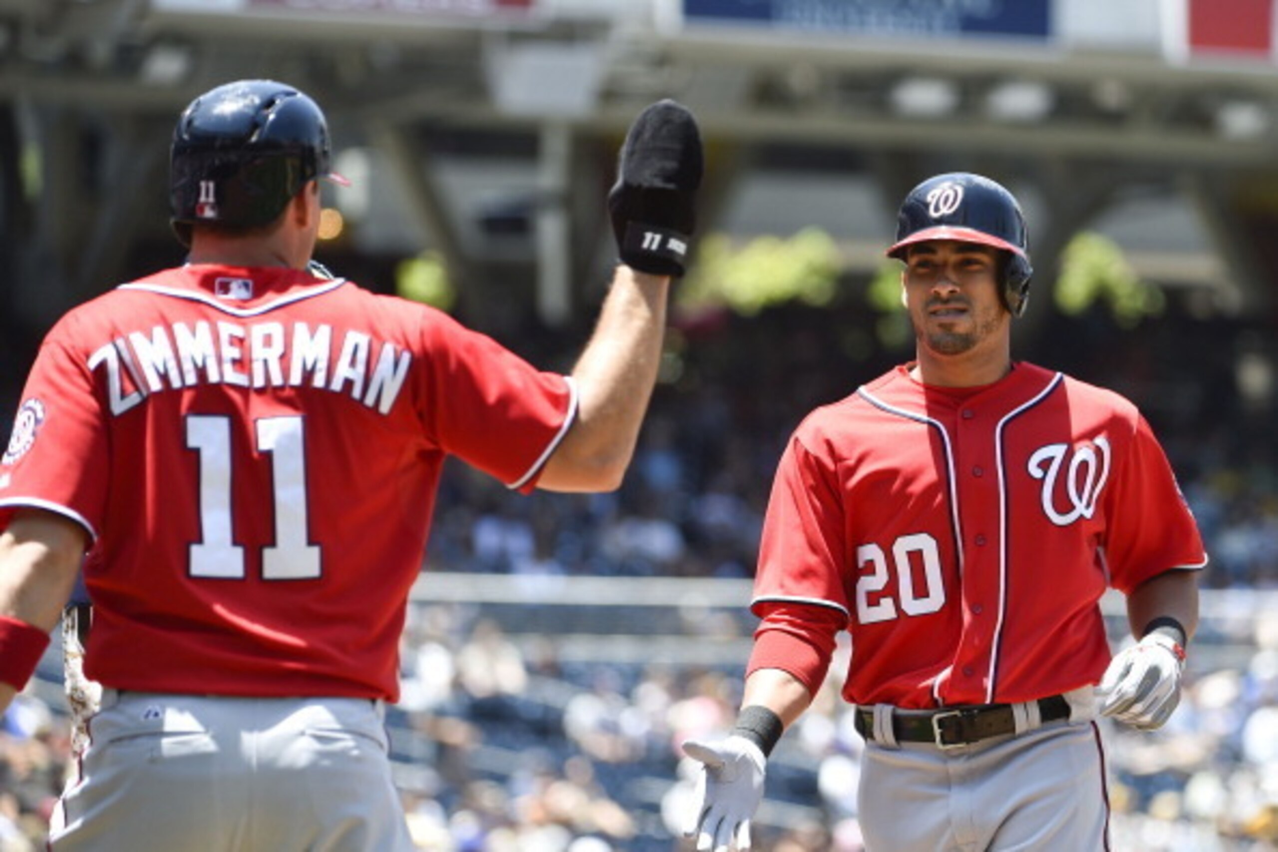 SAN DIEGO, CA - JUNE 8:  Ian Desmond #20 of the Washington Nationals, right, is congratulated by Ryan Zimmerman #11 after he hit a two-run home run during the second inning of a baseball game against the San Diego Padres at Petco Park June 8, 2014 in San 
