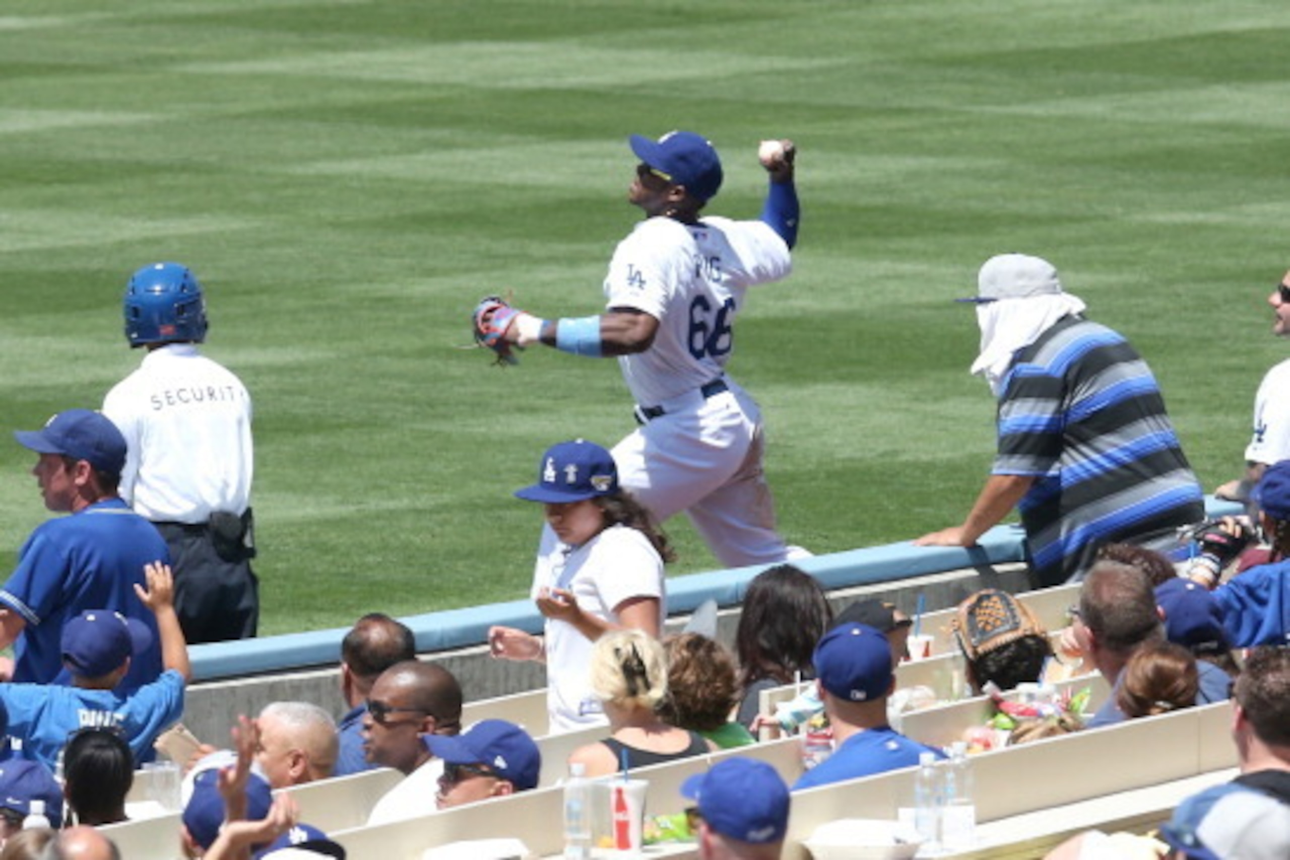 LOS ANGELES, CA - JUNE 15:   Right fielder Yasiel Puig #66 of the Los Angeles Dodgers throws to second base to get Cody Ross of the Arizona Diamondbacks trying to stretch a single for the third out of the the top of the fifth inning at Dodger Stadium on J
