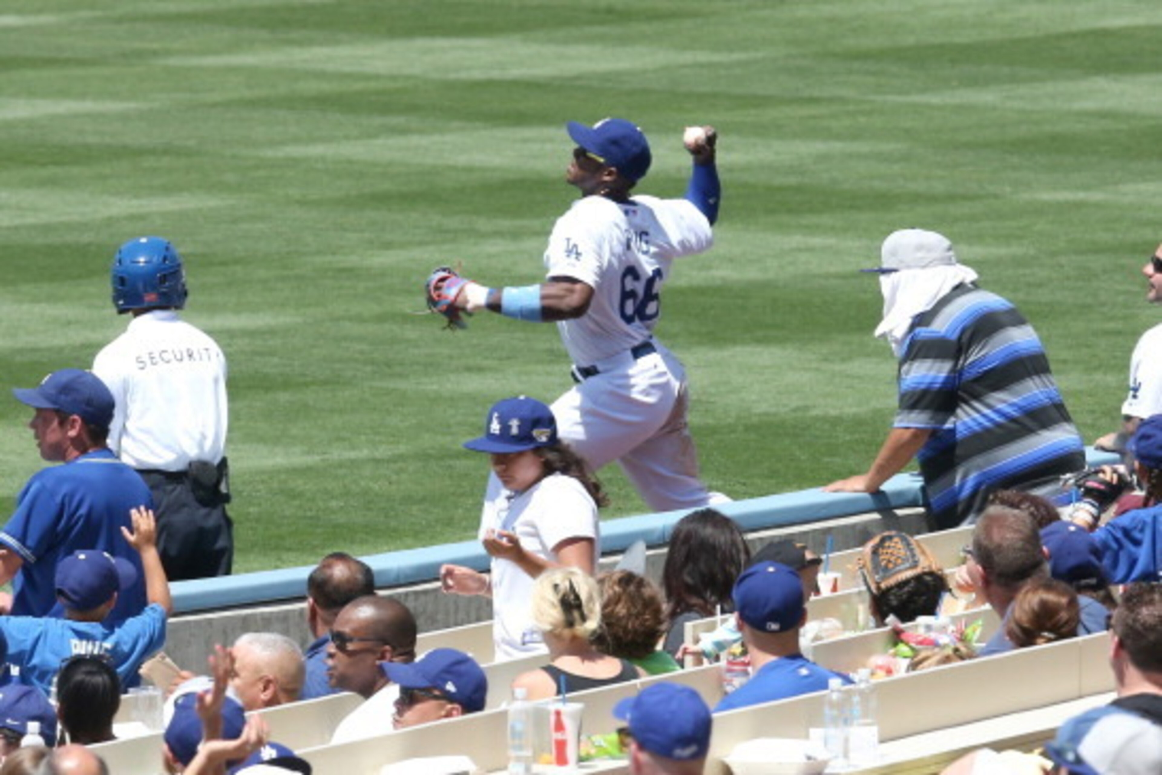 LOS ANGELES, CA - JUNE 15:   Right fielder Yasiel Puig #66 of the Los Angeles Dodgers throws to second base to get Cody Ross of the Arizona Diamondbacks trying to stretch a single for the third out of the the top of the fifth inning at Dodger Stadium on J