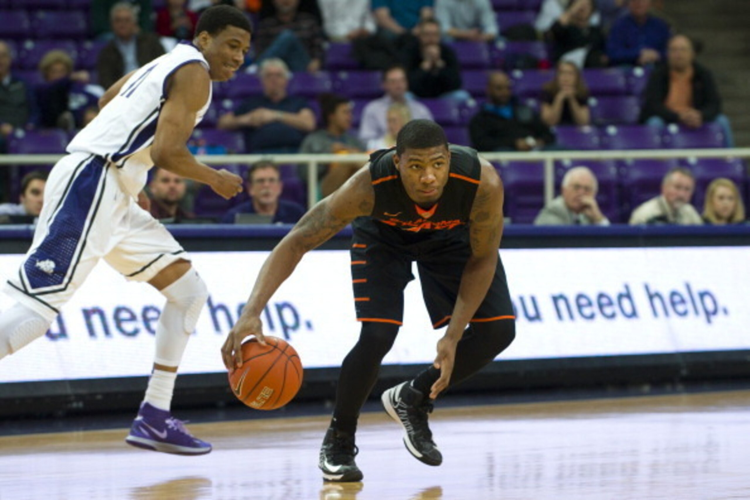 FORT WORTH, TX - FEBRUARY 24: Marcus Smart #43 of the Oklahoma State Cowboys grabs a lose ball against the TCU Horned Frogs on February 24, 2014 at Daniel-Meyer Coliseum in Fort Worth, Texas. (Photo by Cooper Neill/Getty Images) FORT WORTH, TX - FEBRUARY 24: Marcus Smart #43 of the Oklahoma State Cowboys grabs a lose ball against the TCU Horned Frogs on February 24, 2014 at Daniel-Meyer Coliseum in Fort Worth, Texas. (Photo by Cooper Neill/Getty Images)