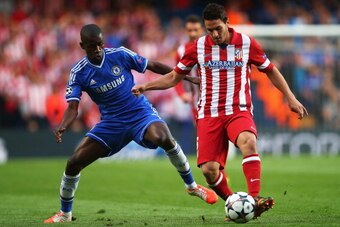 LONDON, ENGLAND - APRIL 30: Koke of Club Atletico de Madrid is tackled by Ramires of Chelsea during the UEFA Champions League semi-final second leg match between Chelsea and Club Atletico de Madrid at Stamford Bridge on April 30, 2014 in London, England. 