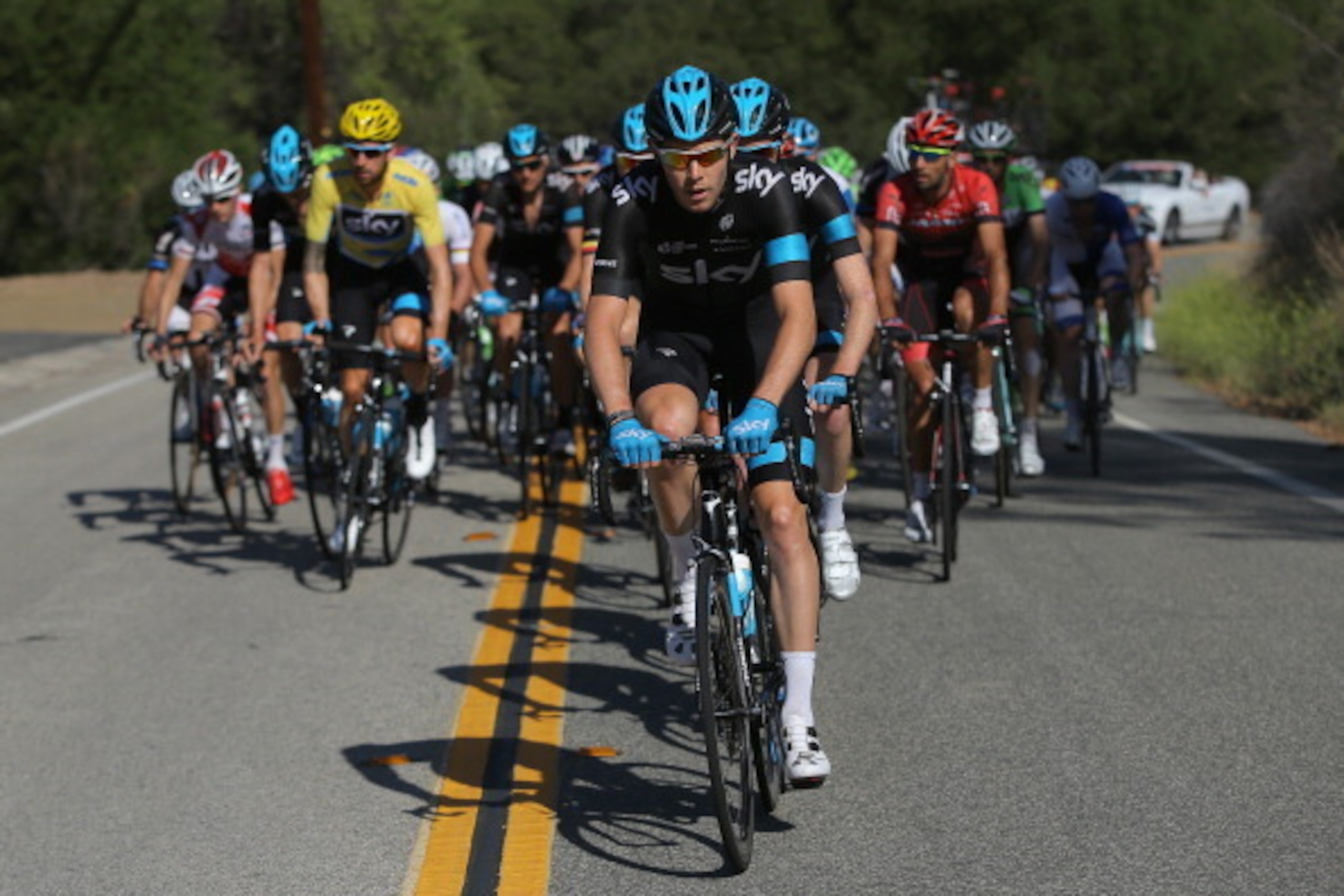 THOUSAND OAKS, CA - MAY 18:  Luke Rowe of Great Britain riding for Team Sky drives the peloton as they defend the overall race leader's yellow jersey for Sir Bradley Wiggins of Great Britain riding for Team Sky during stage eight of the 2014 Amgen Tour of